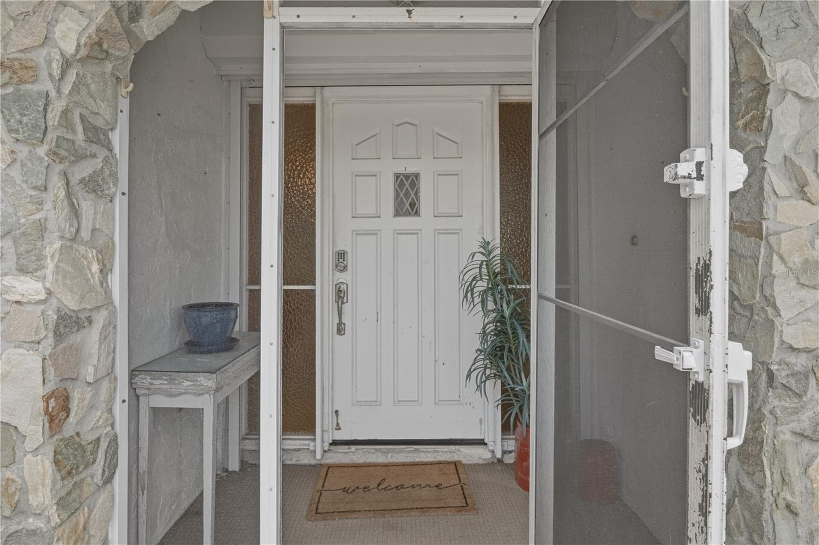 Screened Front Entry with Charming Coastal Touches - 2284 BROAD RANCH DR, PORT CHARLOTTE