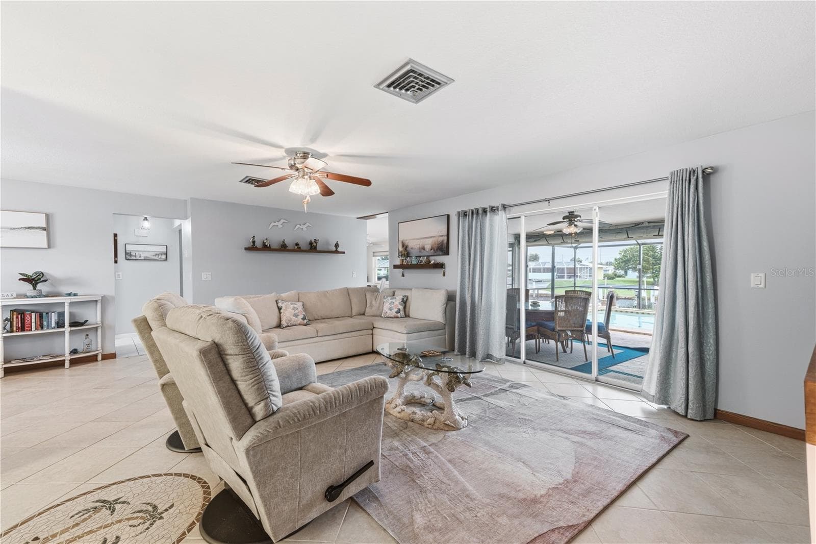 Coastal Living Room Overlooking Pool & Lakefront Views - 2284 BROAD RANCH DR, PORT CHARLOTTE