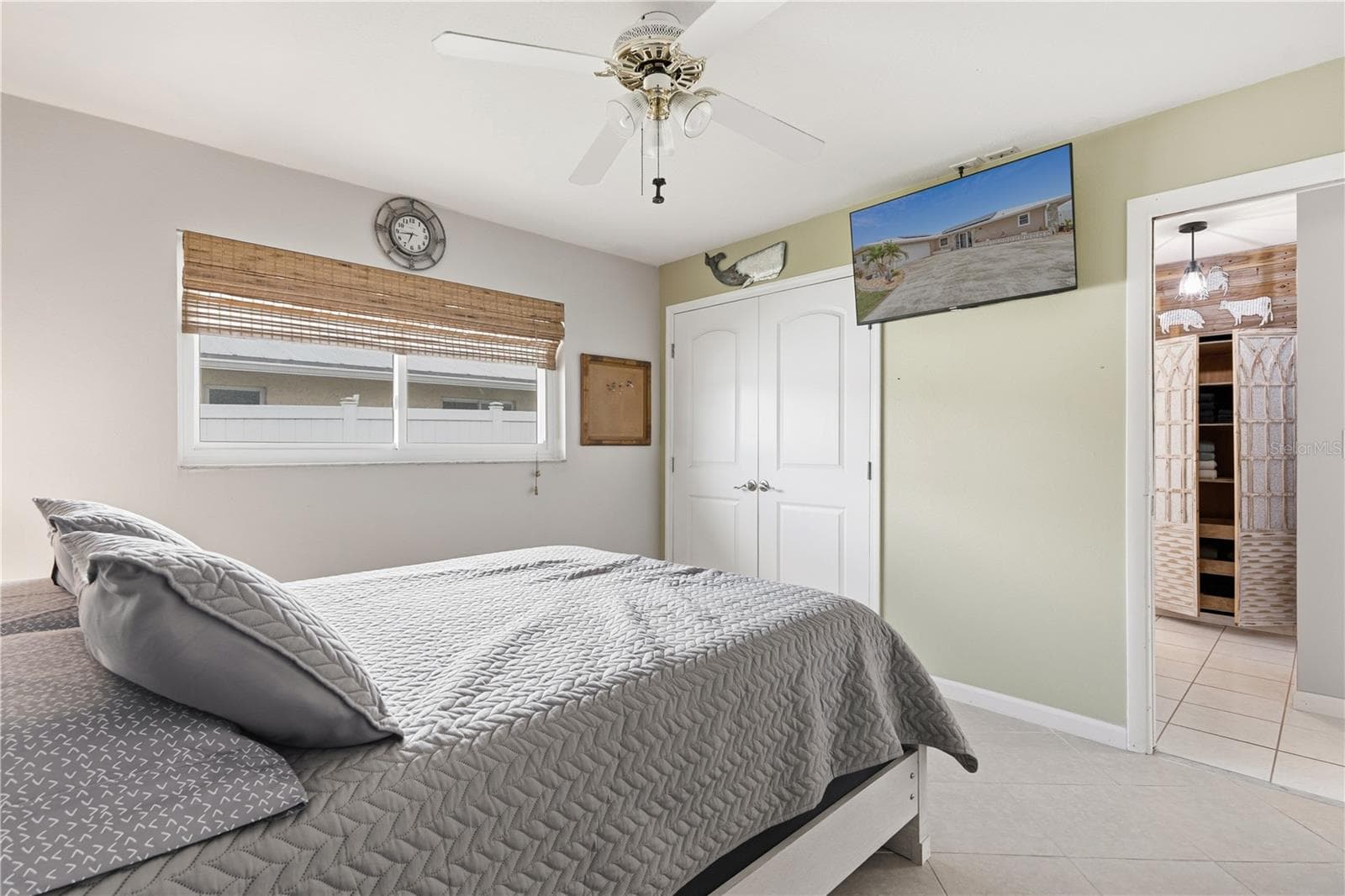 Turnkey Furnished Second Bedroom Features Closet with Double Doors - 2284 BROAD RANCH DR, PORT CHARLOTTE