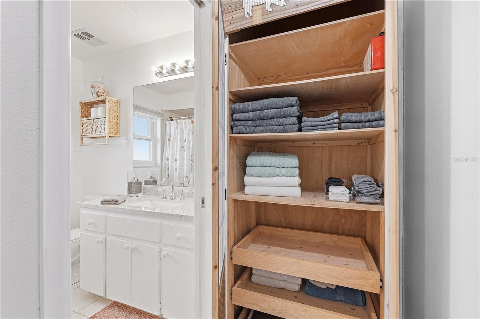 Second Bathroom with Vanity Storage and Linen Closet - 2284 BROAD RANCH DR, PORT CHARLOTTE