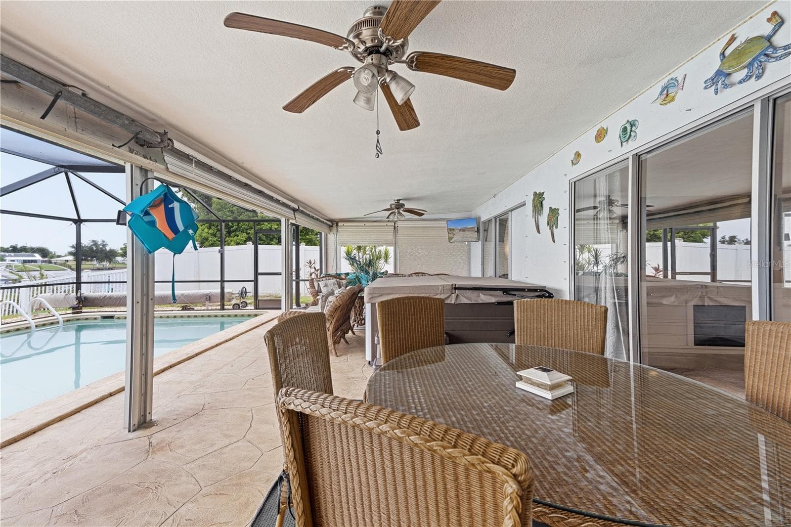 Expansive Covered Patio with Pool, Spa, and Wide Water Views - 2284 BROAD RANCH DR, PORT CHARLOTTE