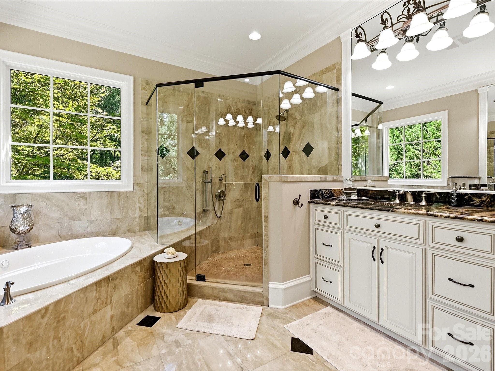 Luxury Primary Bath. There are 2 custom walk-in closets in the primary suite. - 2320 Brawinal Court, Monroe