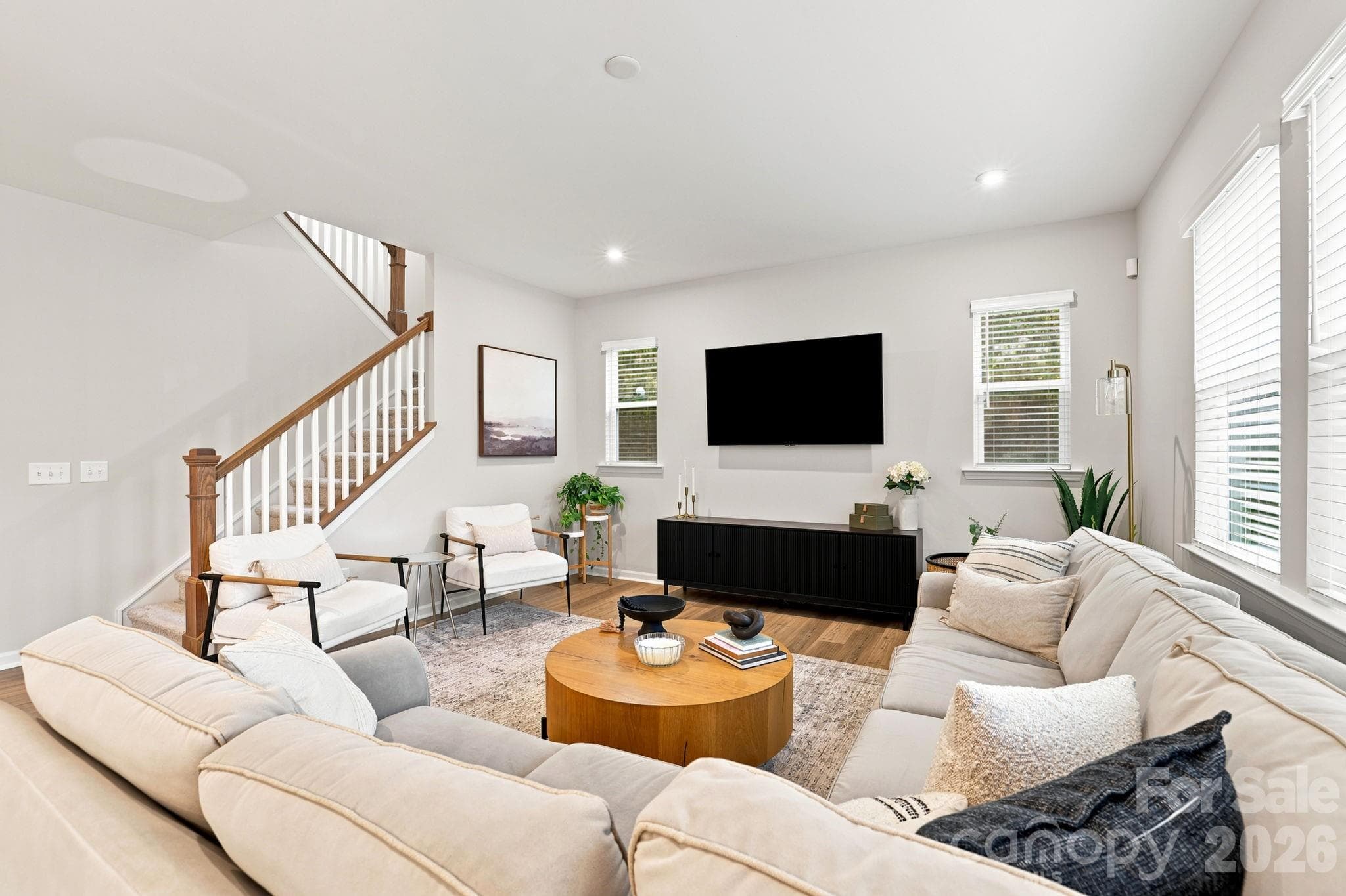 Generous Family Room with luxury vinyl plank flooring. Notice recessed lighting too - 8226 Franklin Trail Street, Mint Hill
