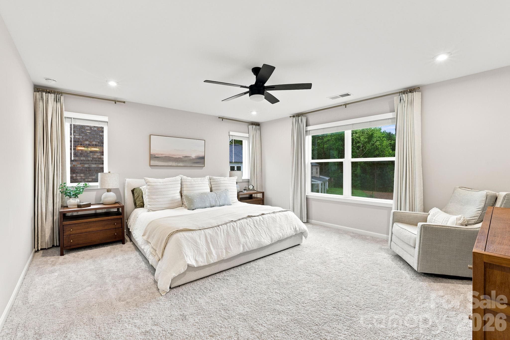 Oversized Primary Bed with lots of natural light- windows all have blinds too.  And recessed lighting provides light as well - 8226 Franklin Trail Street, Mint Hill