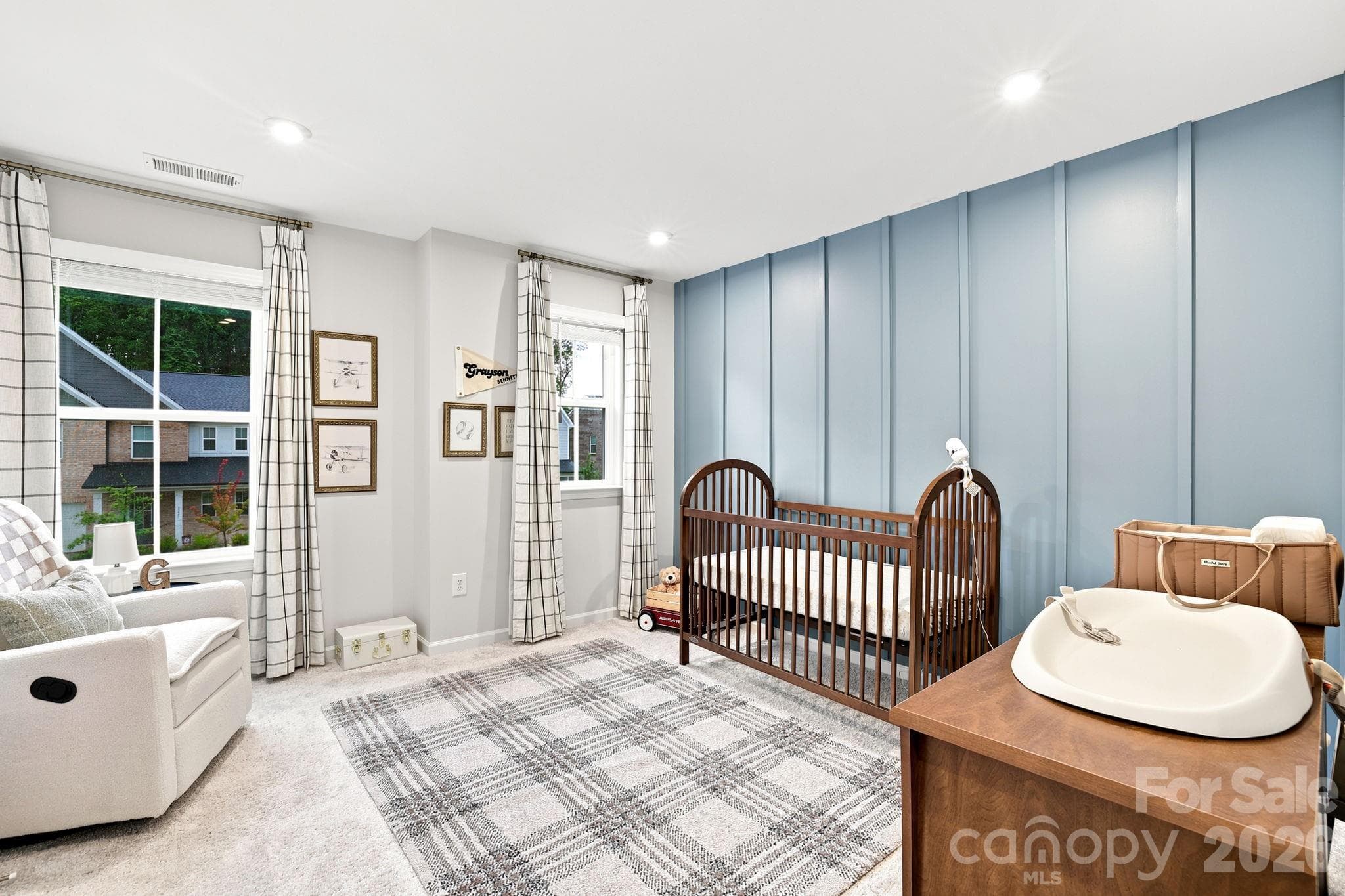Bed 2 has panel accent wall and recessed lighting and abundant natural light.  Nice size closet too! - 8226 Franklin Trail Street, Mint Hill