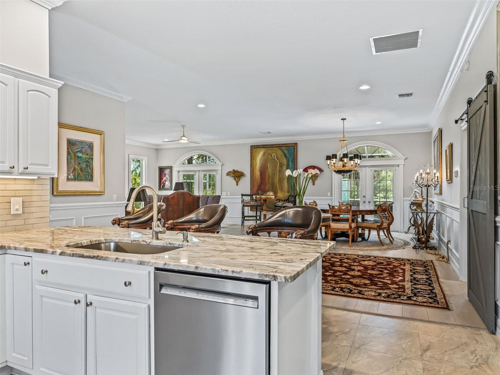 From the kitchen, the open Rancho Mirage floor plan provides clear sightlines into the spacious living area, creating an ideal layout for entertaining and everyday living. - 714 CIMARRON AVE, THE VILLAGES