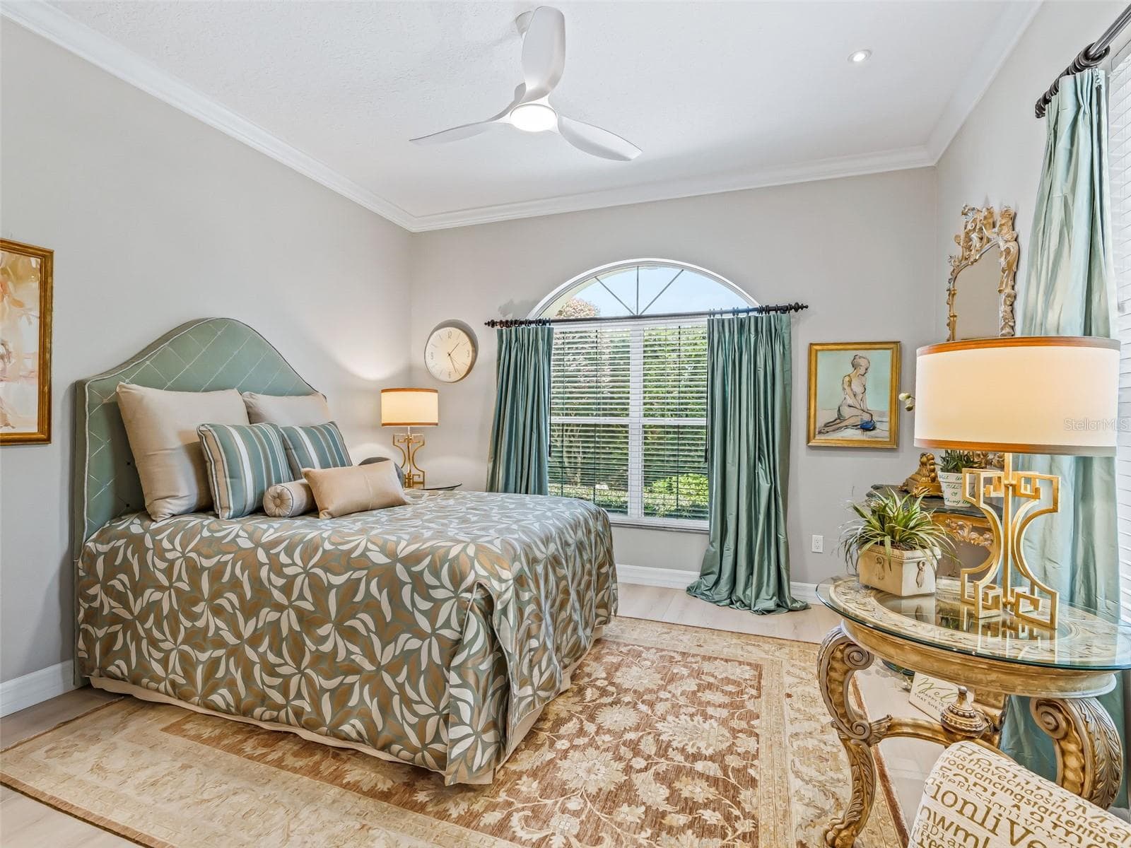 Another view of the guest bedroom highlights its spacious layout, soft neutral finishes, large windows, and attractive architectural detail. - 714 CIMARRON AVE, THE VILLAGES