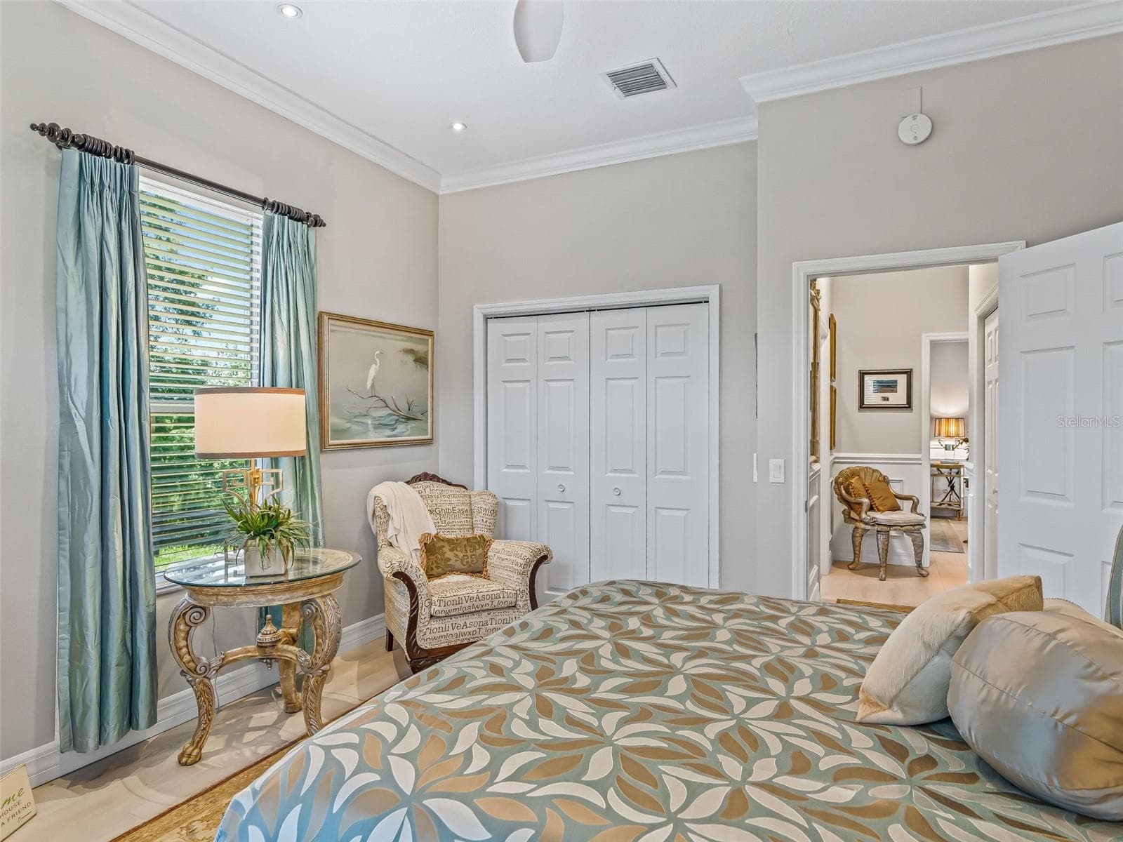 This well-proportioned guest room includes a large closet, ceiling fan, and plenty of space for a full bedroom suite while maintaining a bright, comfortable feel. - 714 CIMARRON AVE, THE VILLAGES