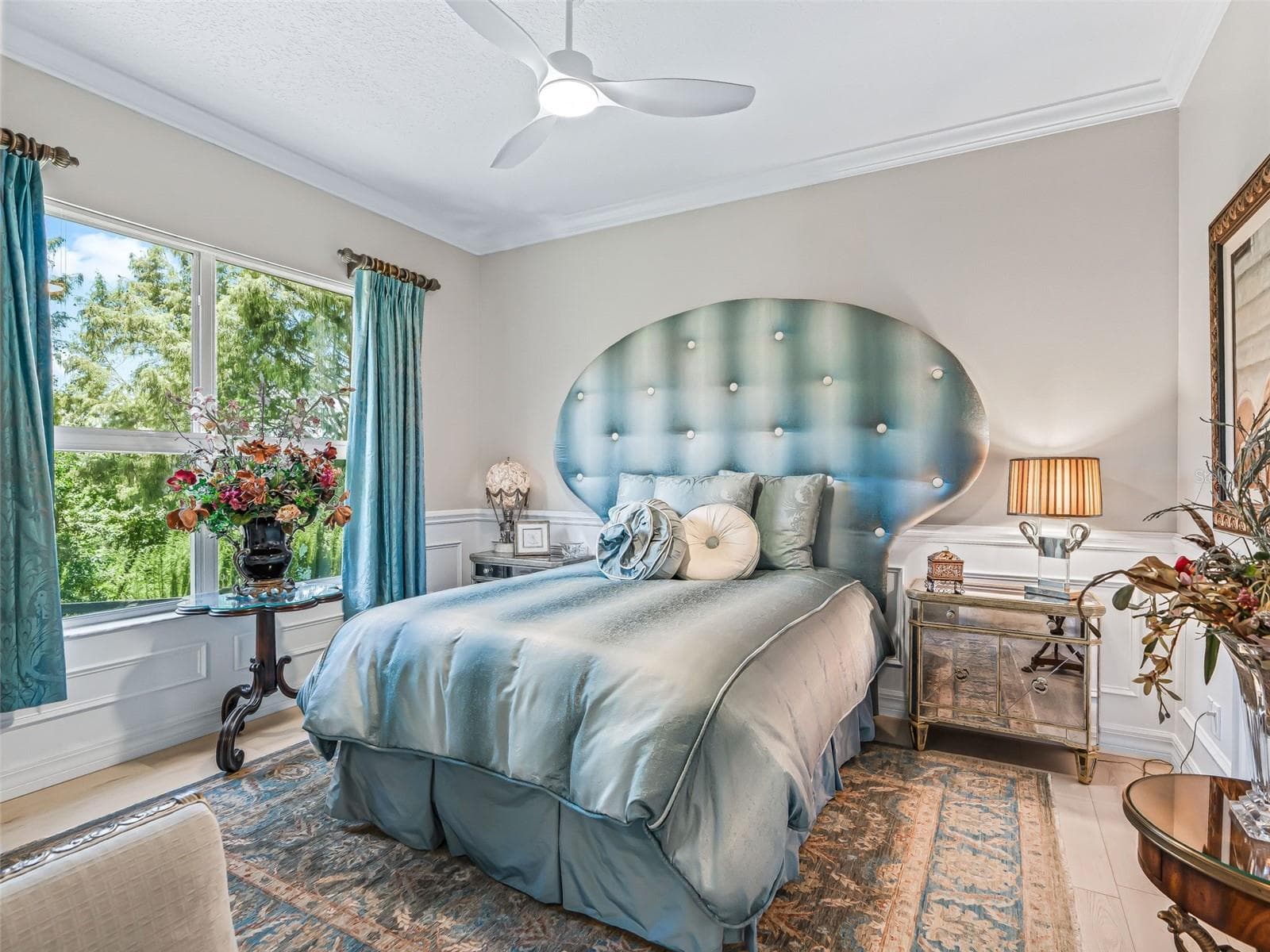 The additional 13'x12' guest bedroom offers a bright and inviting retreat with luxury vinyl plank flooring, ceiling fan, large window, and generous proportions. - 714 CIMARRON AVE, THE VILLAGES