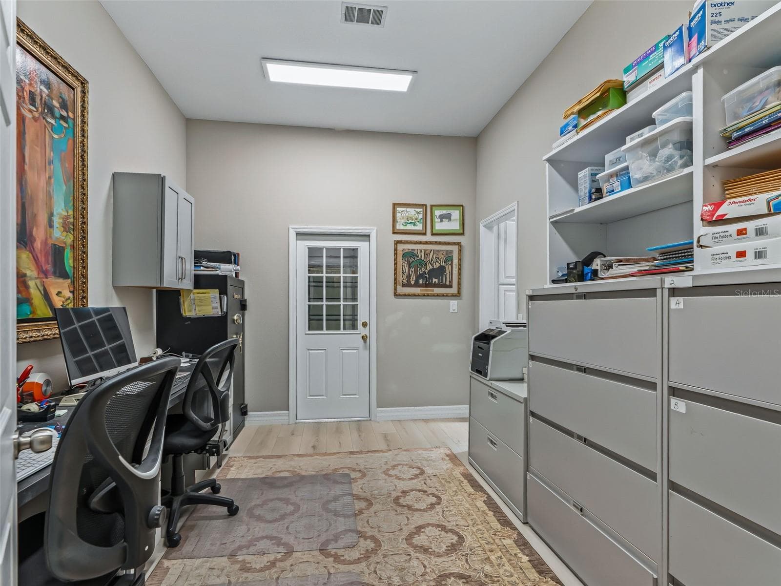 Another view of the private office highlights the generous cabinetry, work surfaces, storage options, and separation from the main living areas. - 714 CIMARRON AVE, THE VILLAGES