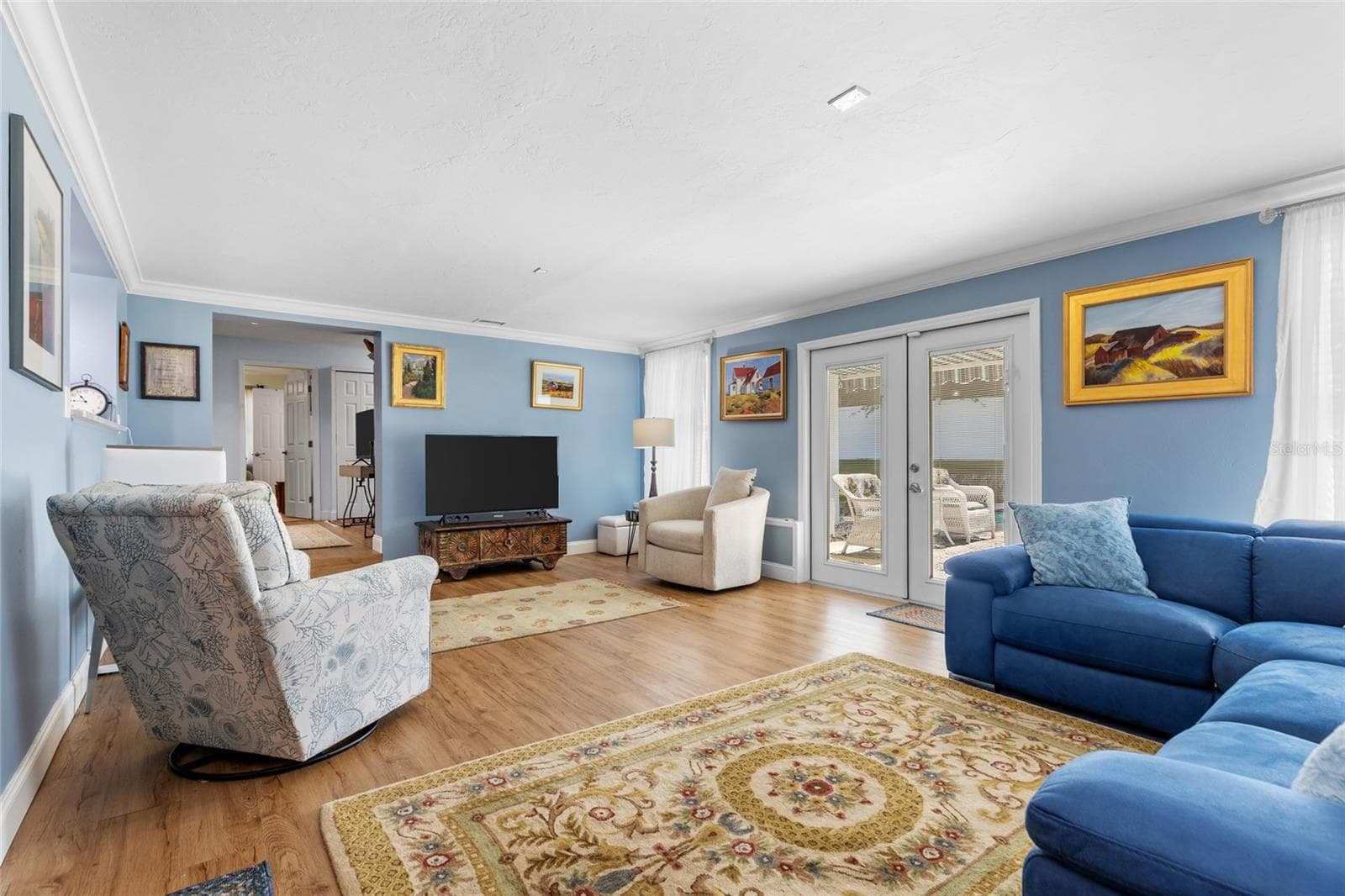 Great Room, with French doors opening to the backyard and pool. - 6249 HILLSIDE AVE, SEMINOLE