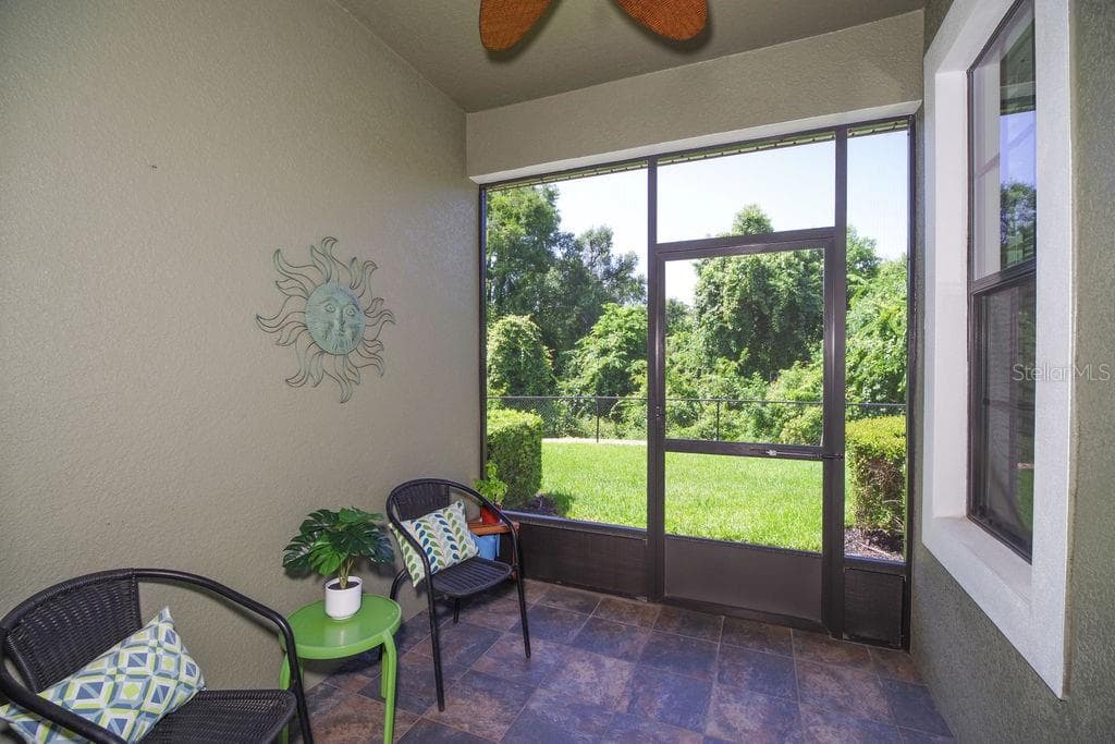 SCREENED PORCH WITH SLATE FLOORS OVERLOOKING CONSERVATION, WATER AND GOLF COURSE - 1541 CORKERY CT #1541, WINTER SPRINGS