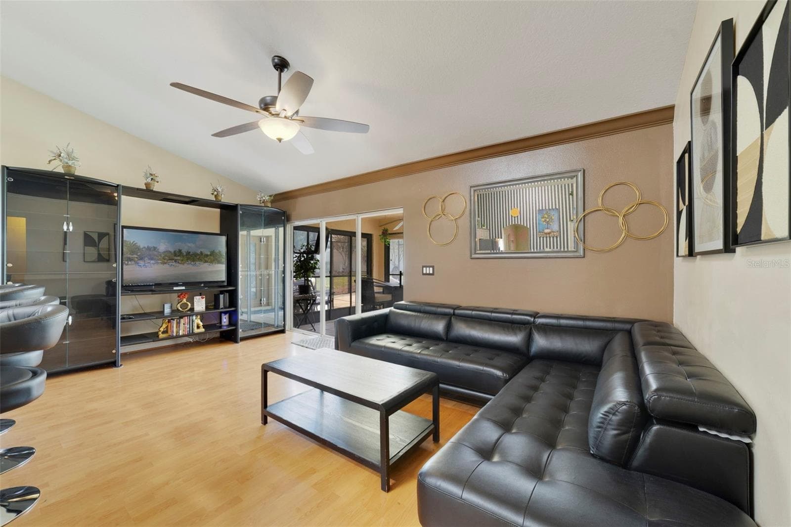 Spacious family room has triple sliding glass doors that open to a screened lanai. - 255 LOMA DEL SOL DR, DAVENPORT