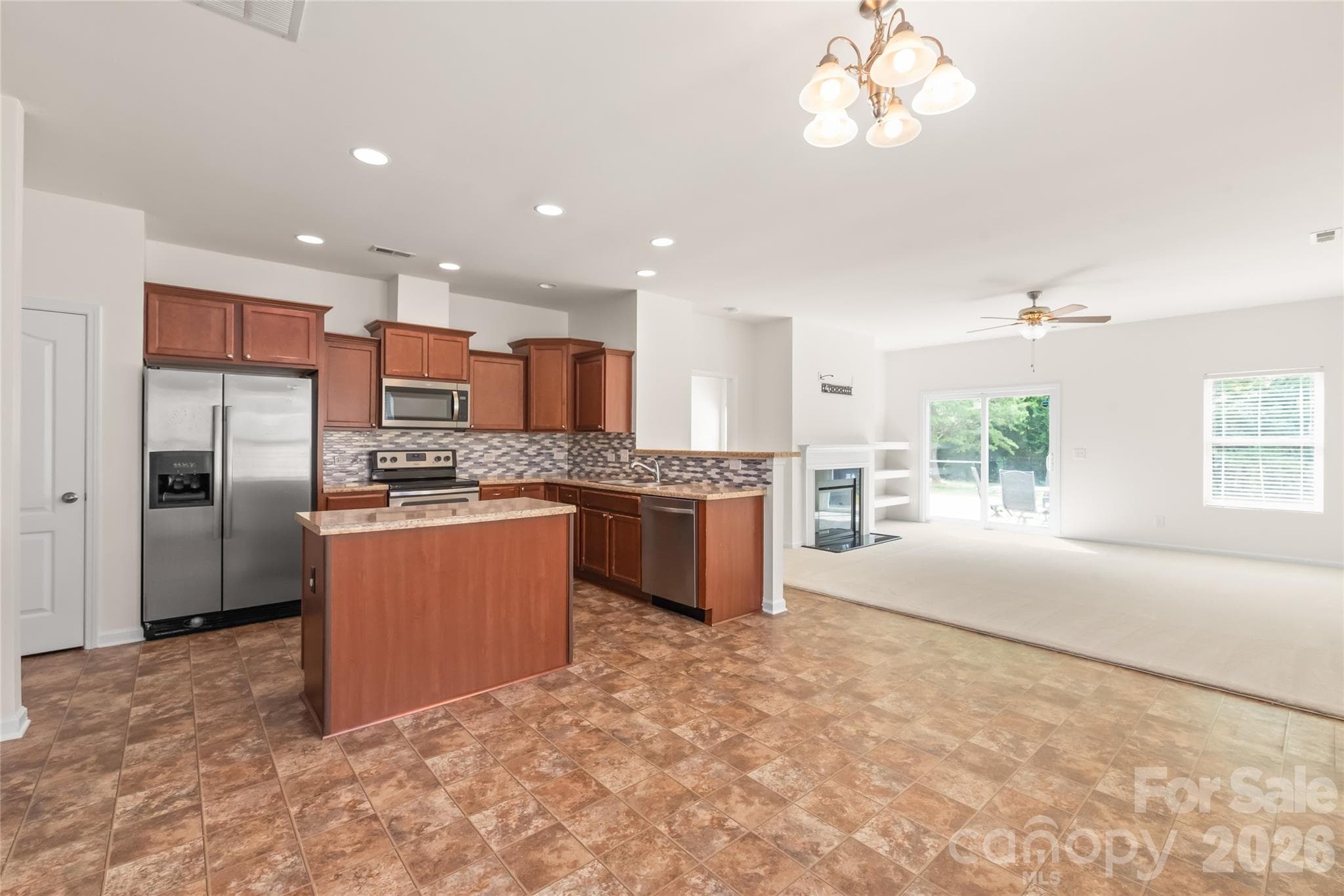 Kitchen that opens up to ample dining space and the living room makes for a great open floorplan. - 8411 Romana Red Lane, Charlotte