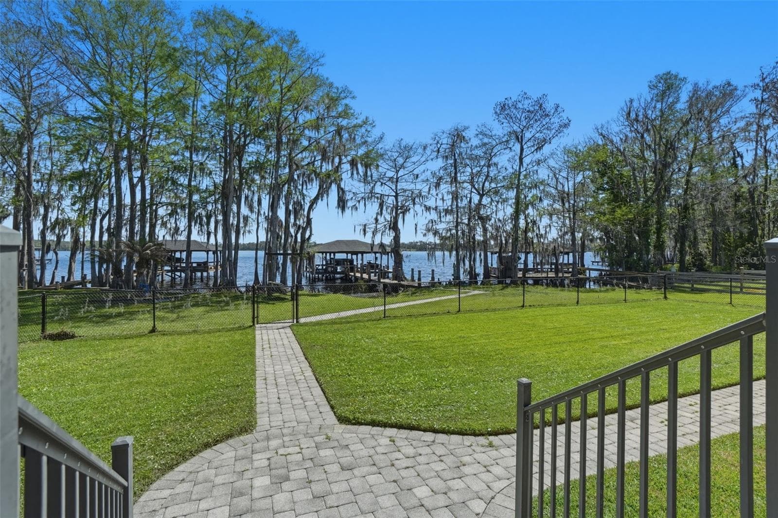 Backyard with lake views - 834 MILLSHORE DR, CHULUOTA