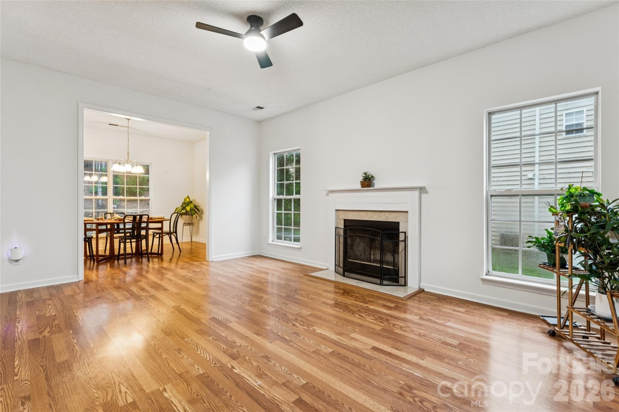 living room with cozy wood burning fireplace - 5645 Winslow Avenue NW, Concord
