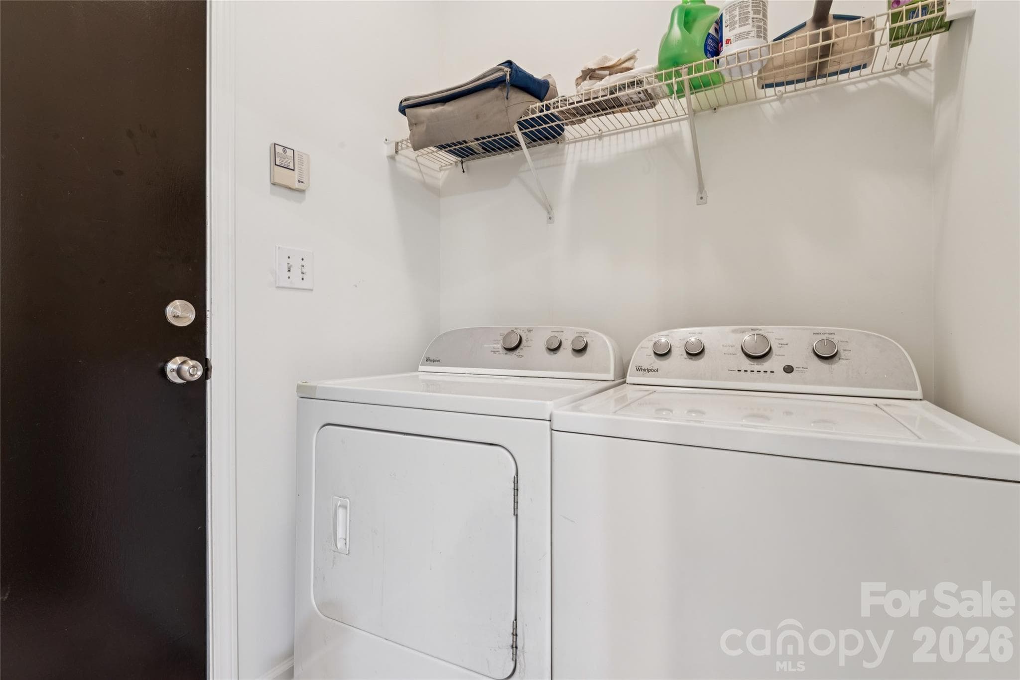 laundry room off kitchen leading to garage - 5645 Winslow Avenue NW, Concord