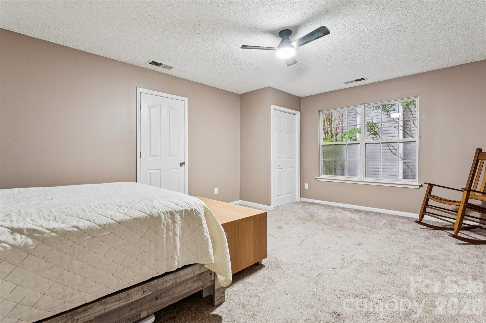 large secondary bedroom with walk out attic storage space - 5645 Winslow Avenue NW, Concord