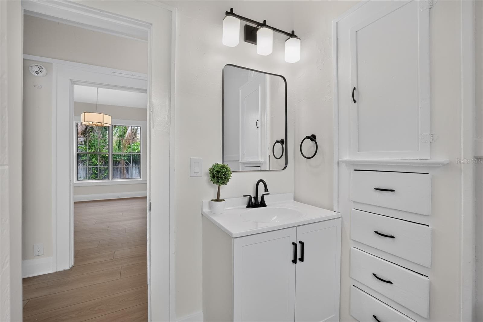 Classic 1922 bungalow bathroom with updated vanity and built-in storage - 813 E NEW ORLEANS AVE, TAMPA