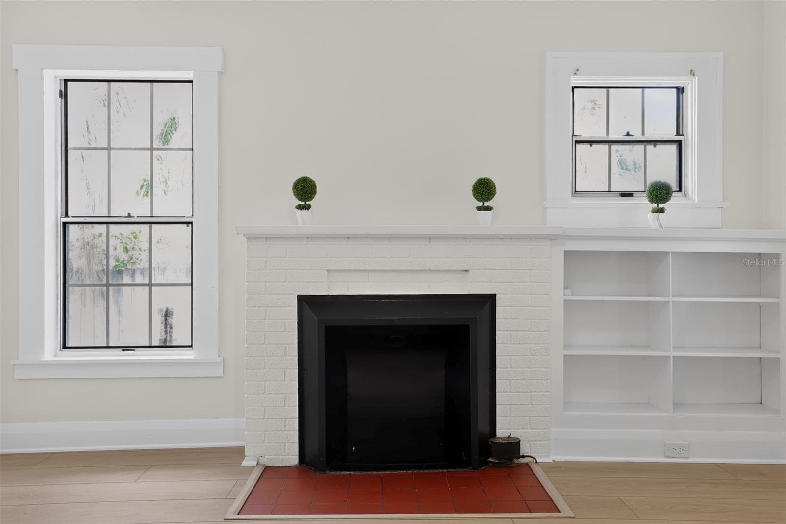 Original fireplace detail in the living room of this charming 1922 bungalow - 813 E NEW ORLEANS AVE, TAMPA