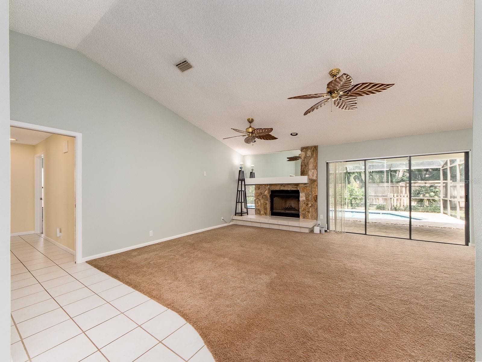 Great room sliders leading to pool - 1612 MIDNIGHT PASS WAY, CLEARWATER