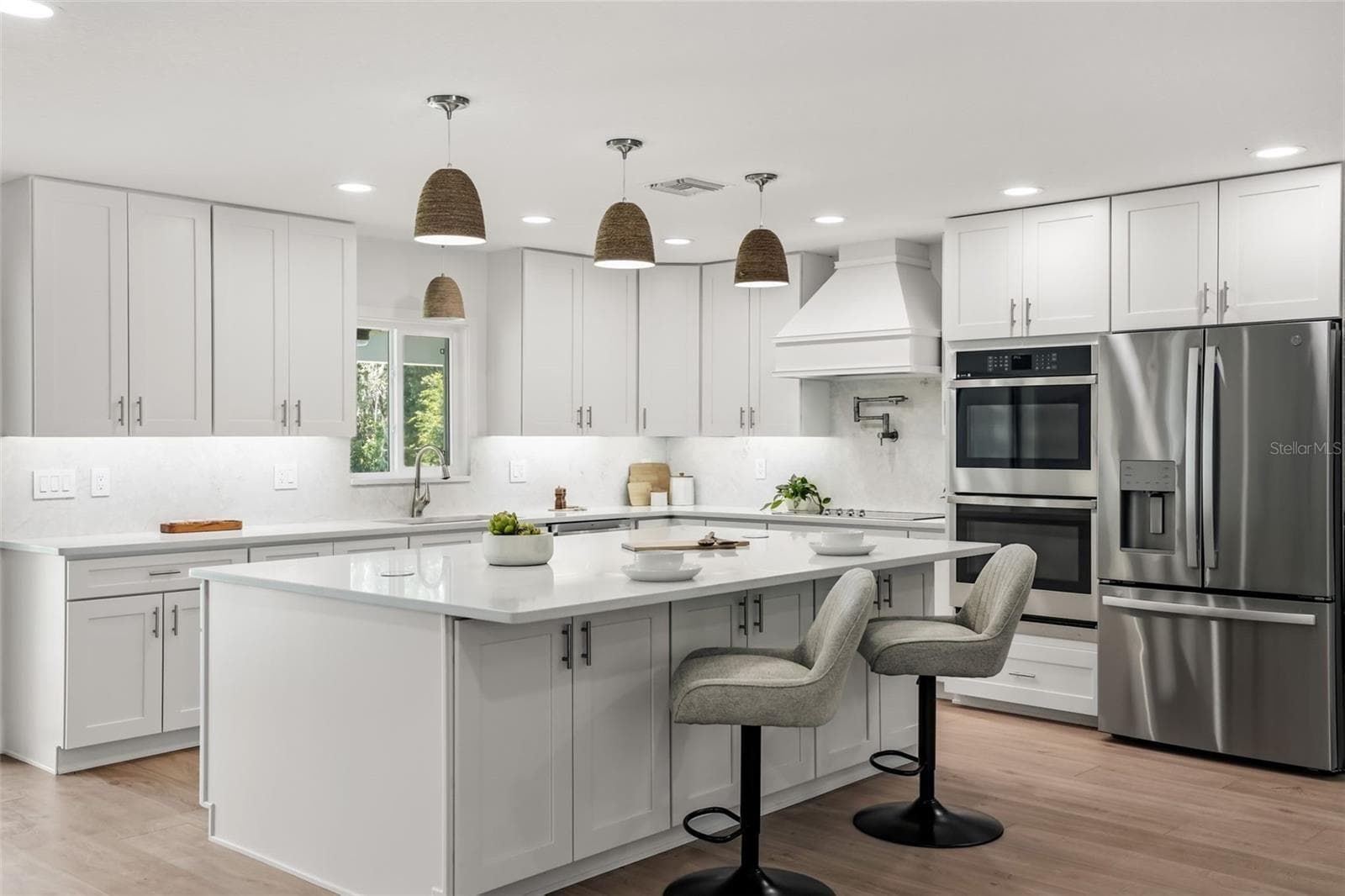 Beautifully designed kitchen featuring an oversized quartz island, premium appliances, and abundant cabinetry - 39251 COUNTY ROAD 439, UMATILLA