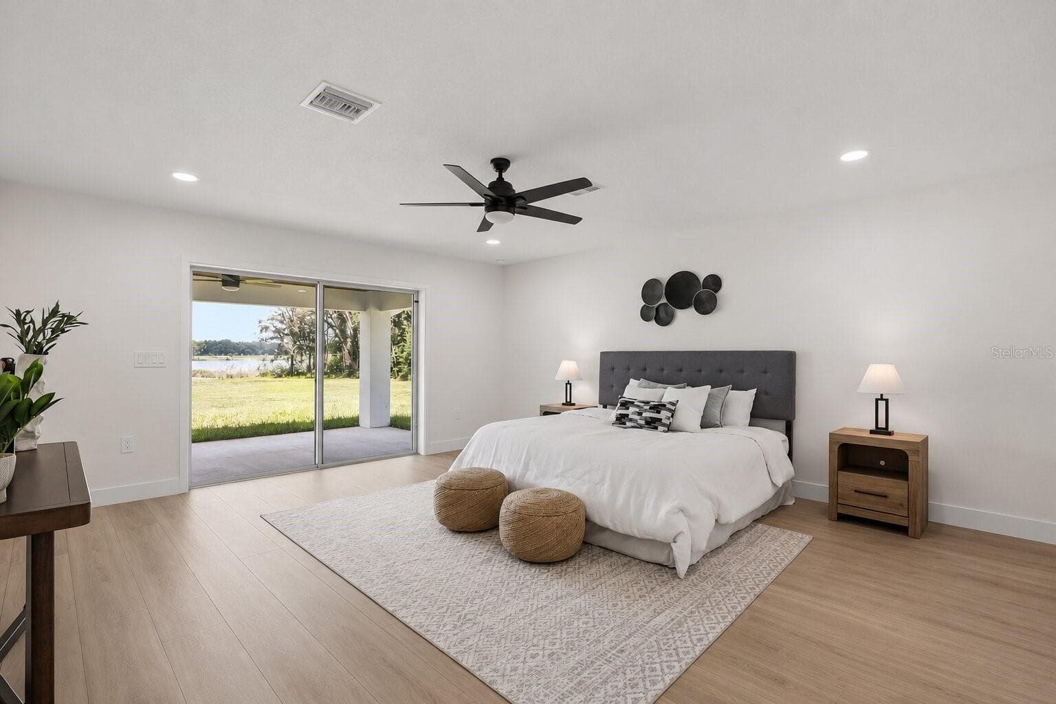 Peaceful primary suite with abundant natural light, lake views, and private lanai access - 39251 COUNTY ROAD 439, UMATILLA