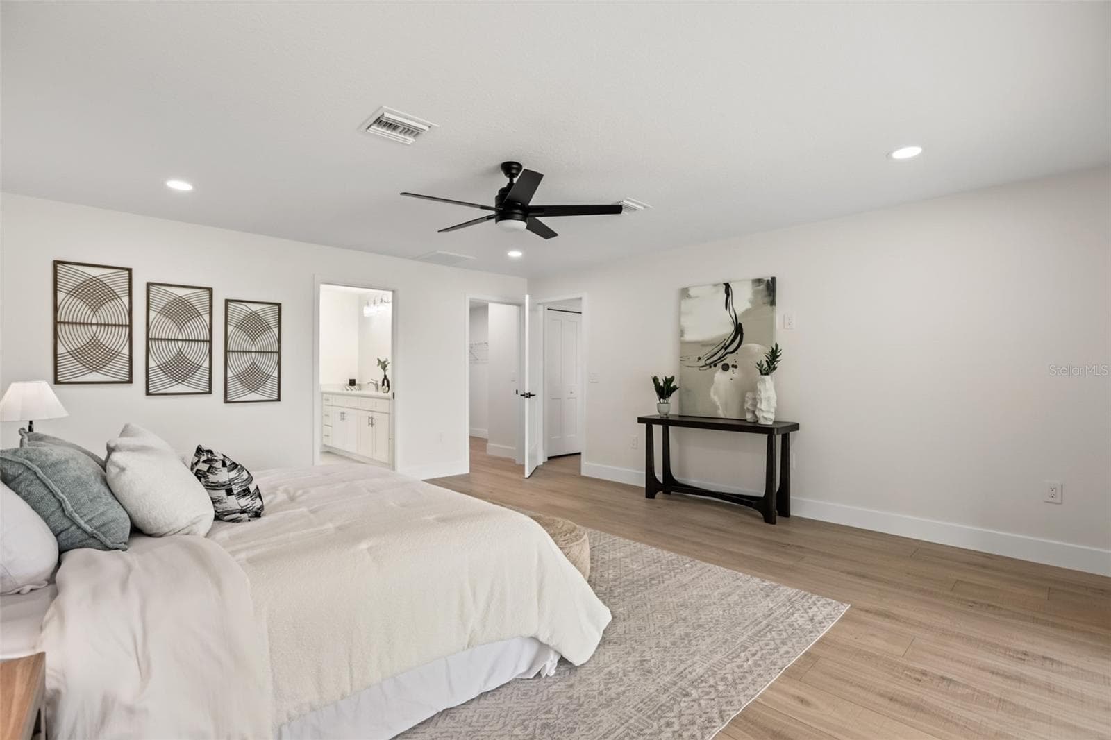 Another view of the spacious primary suite, showcasing its bright and open layout. - 39251 COUNTY ROAD 439, UMATILLA