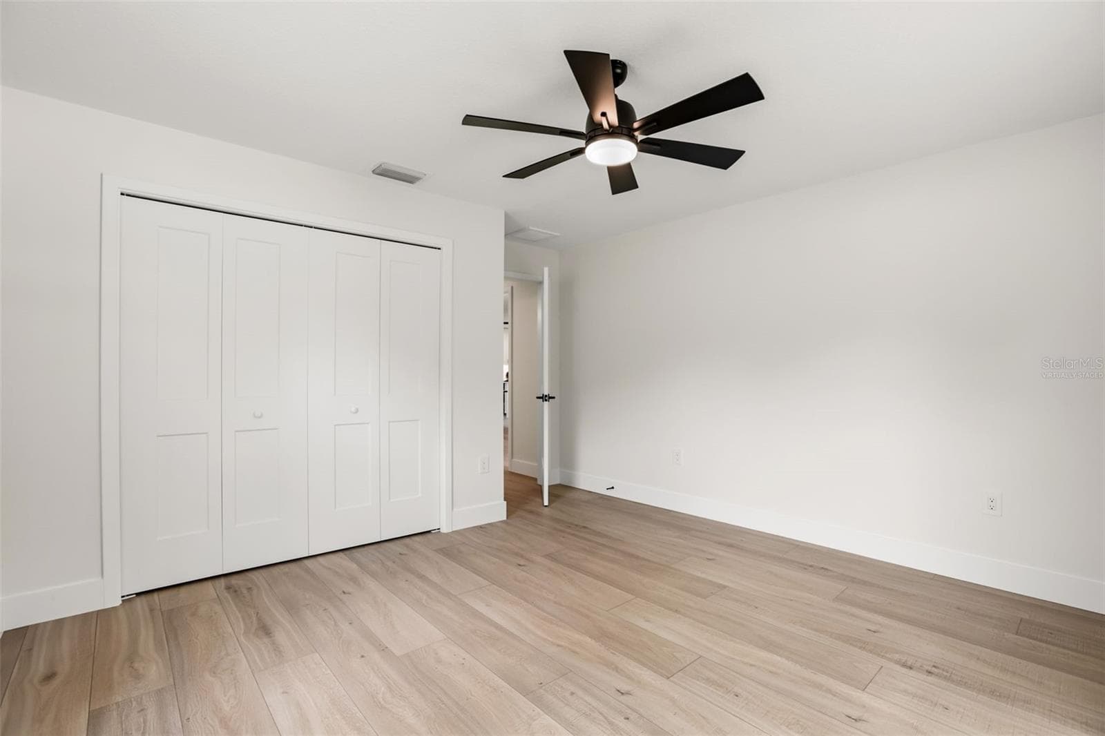 Alternate view of the fourth bedroom, highlighting the versatile space shown virtually staged as a home office. - 39251 COUNTY ROAD 439, UMATILLA