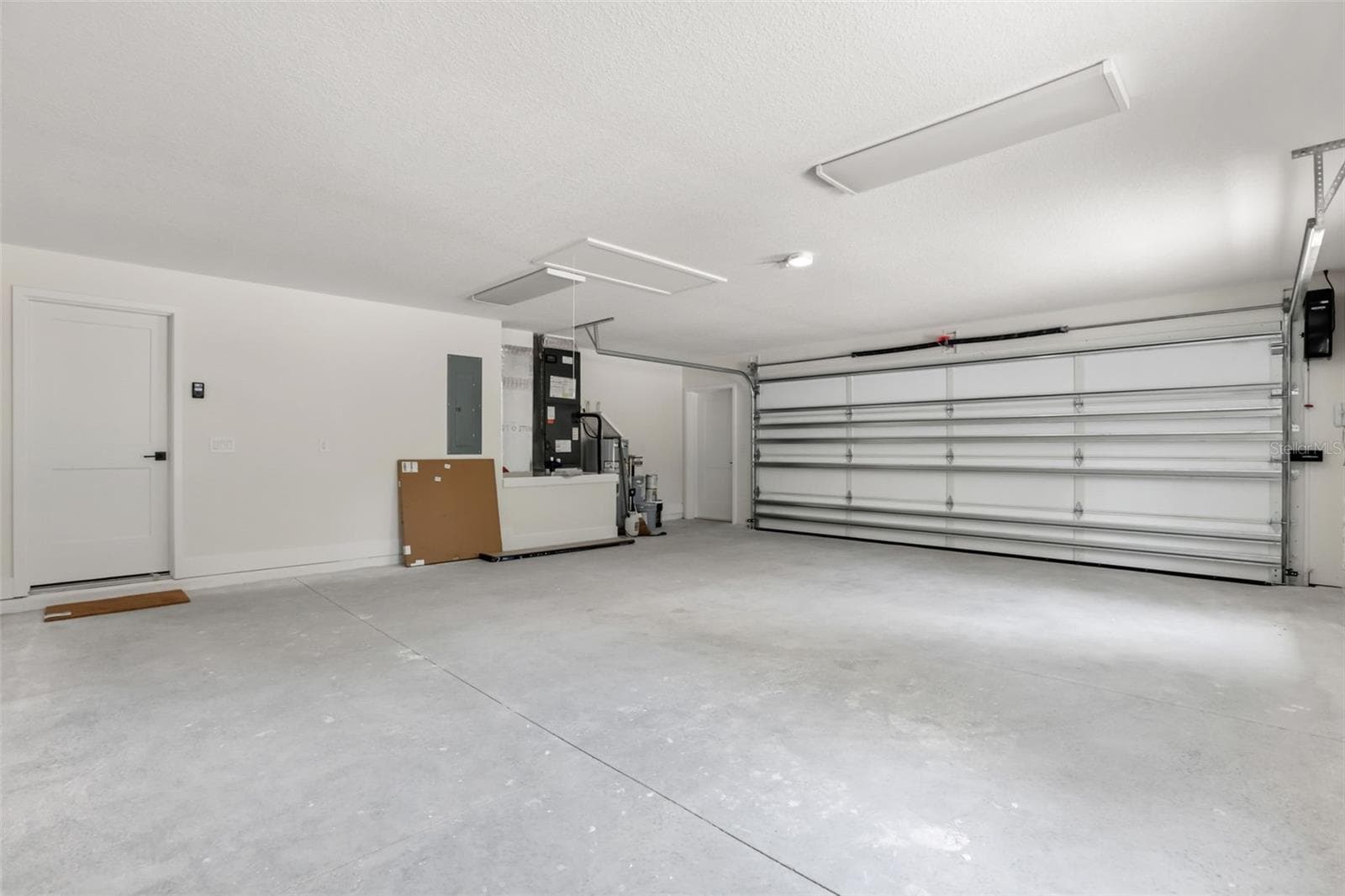 Another perspective of the oversized garage with plenty of room for vehicles, storage, and equipment. - 39251 COUNTY ROAD 439, UMATILLA