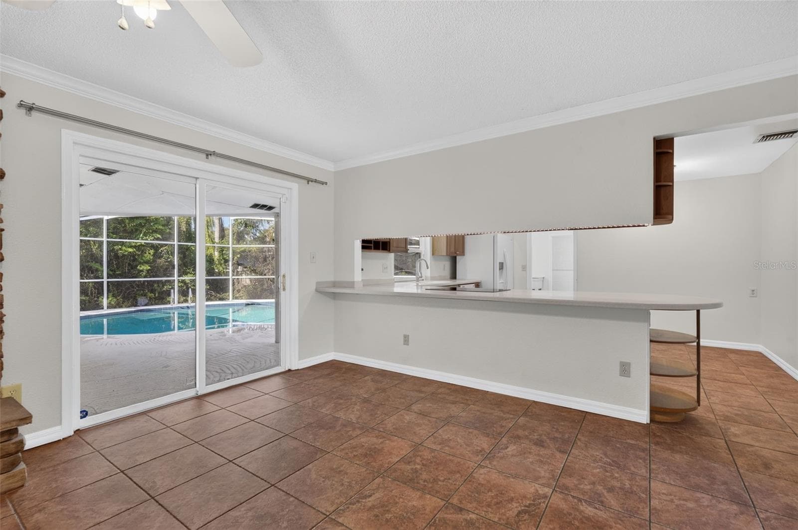 Sliders lead out to screened patio - 2051 DYAN WAY, MAITLAND