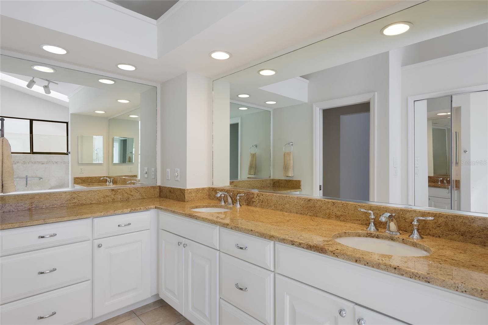 Primary bathroom updated with double sink vanity. - 851 FAULKWOOD CT, SARASOTA