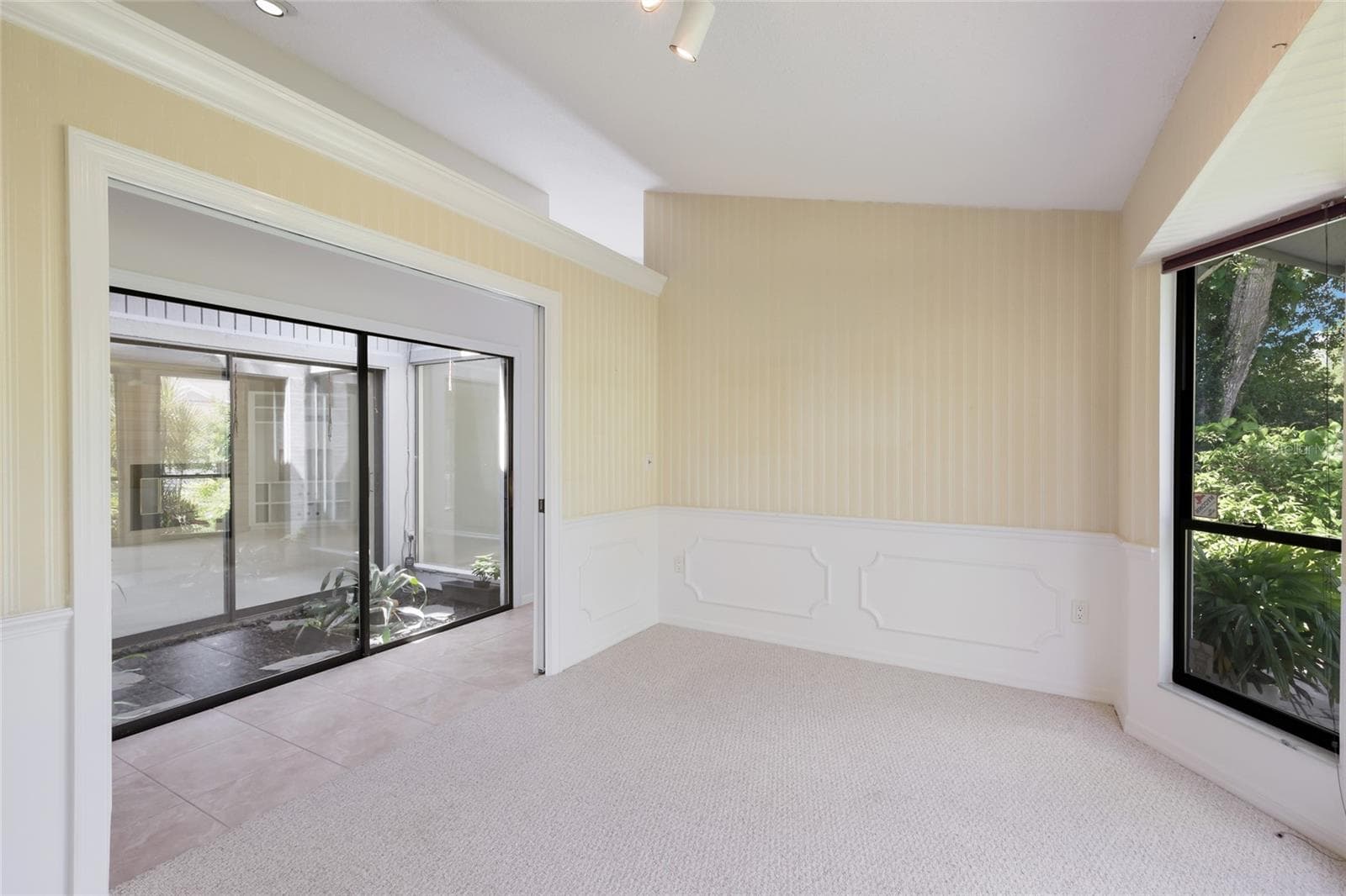 Office/den/dining room with pocket doors. - 851 FAULKWOOD CT, SARASOTA