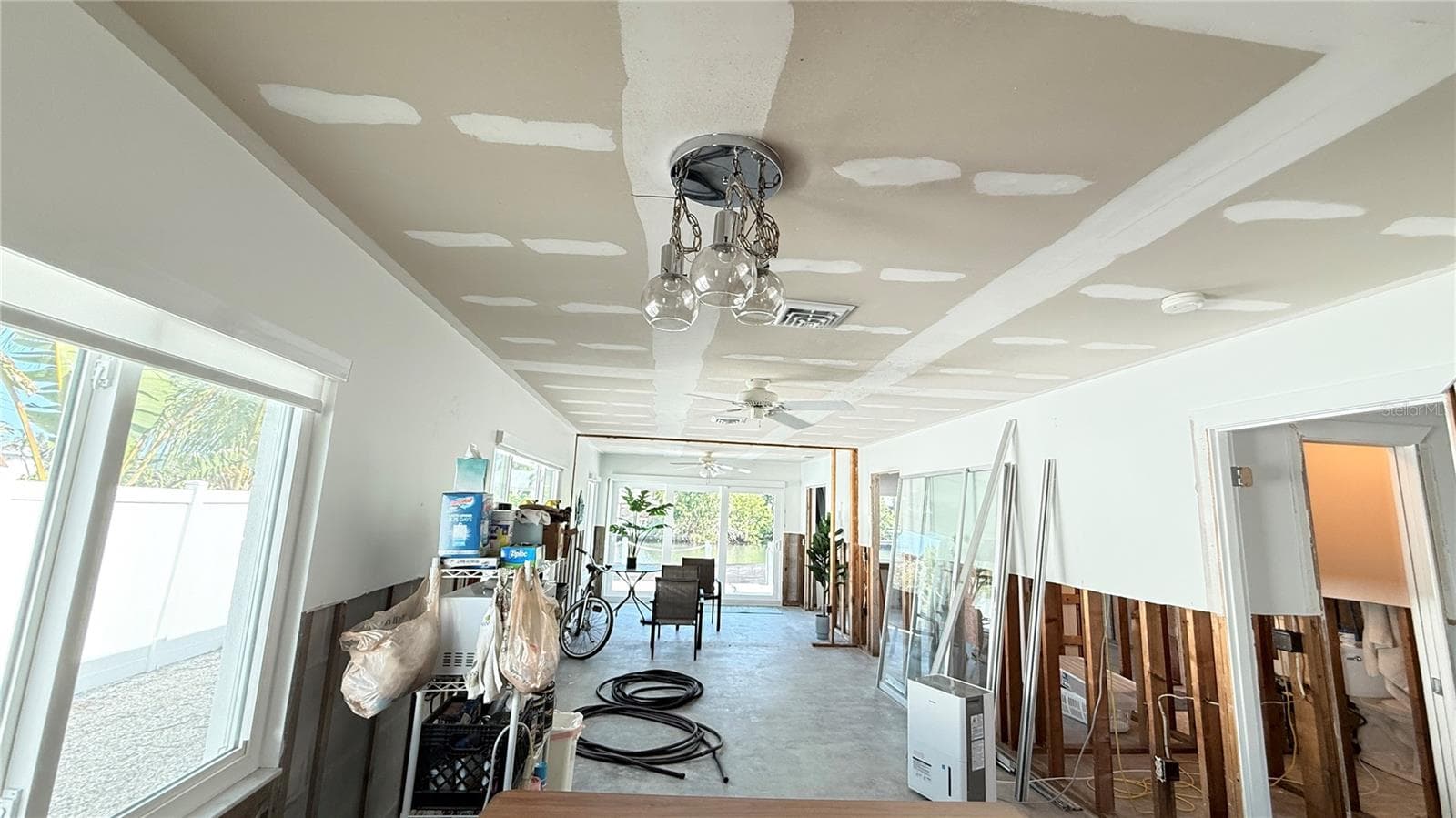 Dining and living areas with both bedrooms and bathrooms just off the living area - 420 63RD ST #420A, HOLMES BEACH