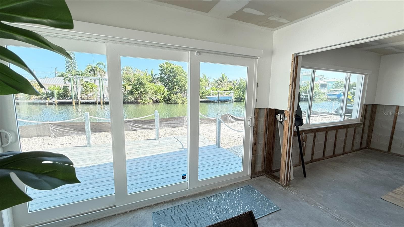 View from the living room through the sliding doors and bedroom window - 420 63RD ST #420A, HOLMES BEACH