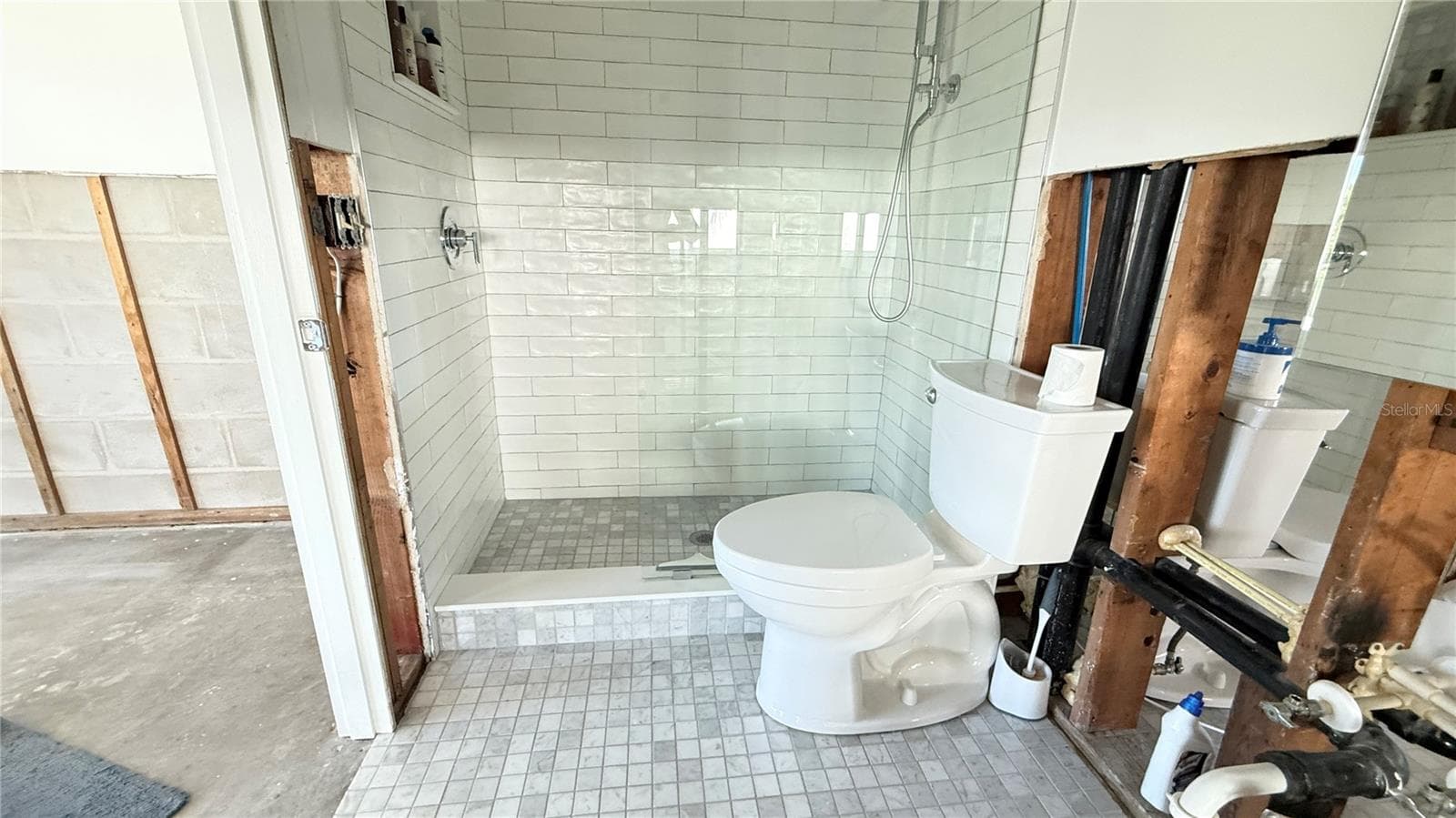 Canal side ensuite bathroom with shower. Bathrooms were remodeled prior to the storm. - 420 63RD ST #420A, HOLMES BEACH