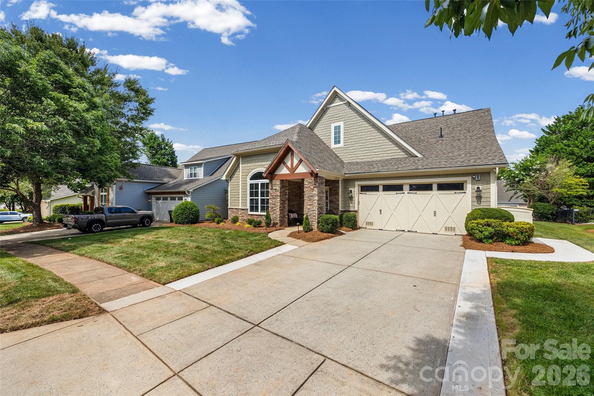 Extended concrete to widen the driveway with a walkway to the garbage corral. - 8621 Sequoia Grove Lane, Charlotte