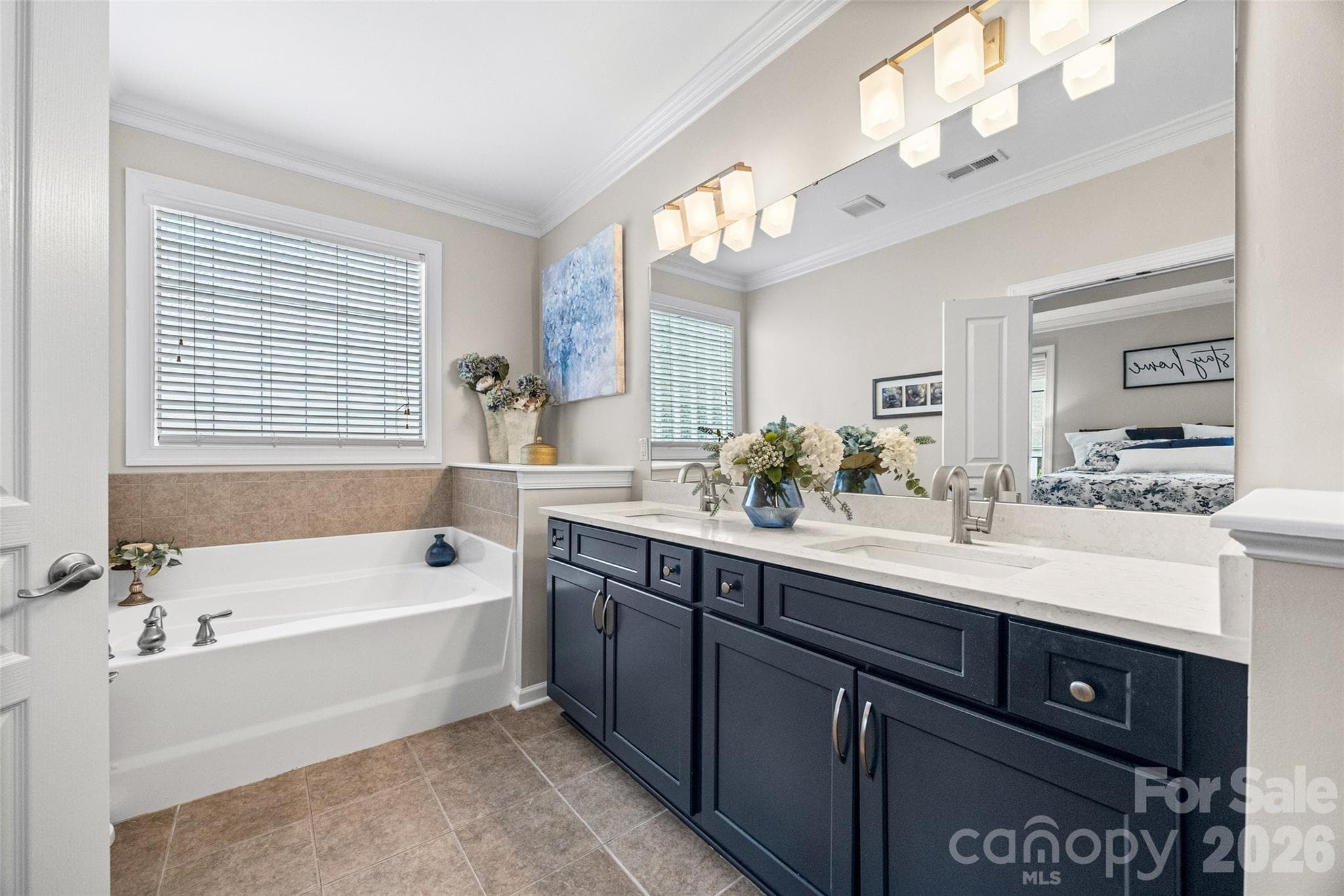 Impressive primary bath with double sinks and soaking tub. - 8621 Sequoia Grove Lane, Charlotte