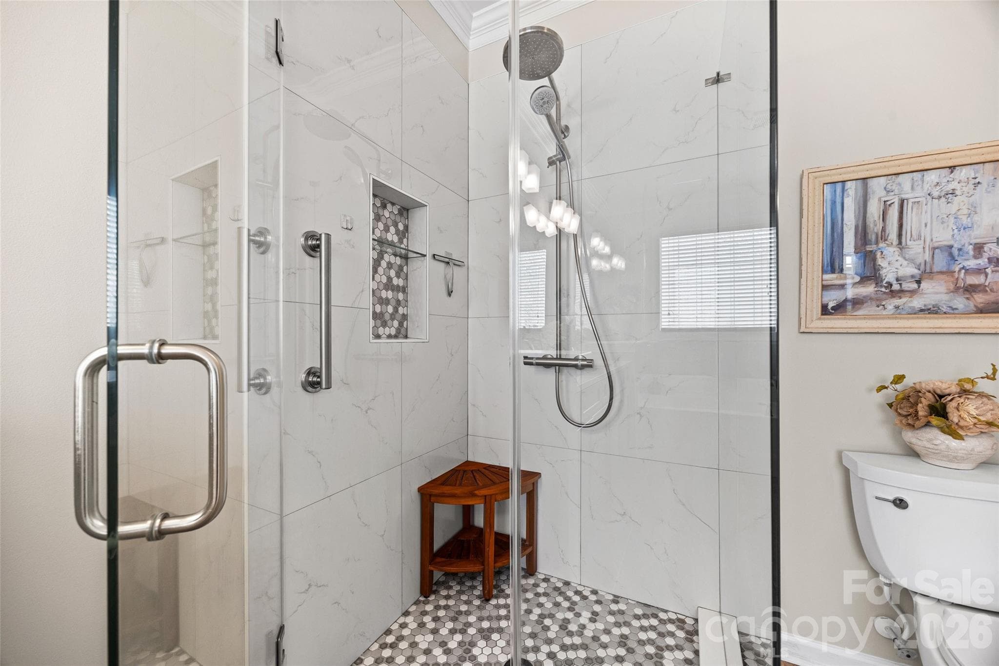 Tiled stand-up shower with contrasting niche & floor and frameless glass enclosure.. - 8621 Sequoia Grove Lane, Charlotte