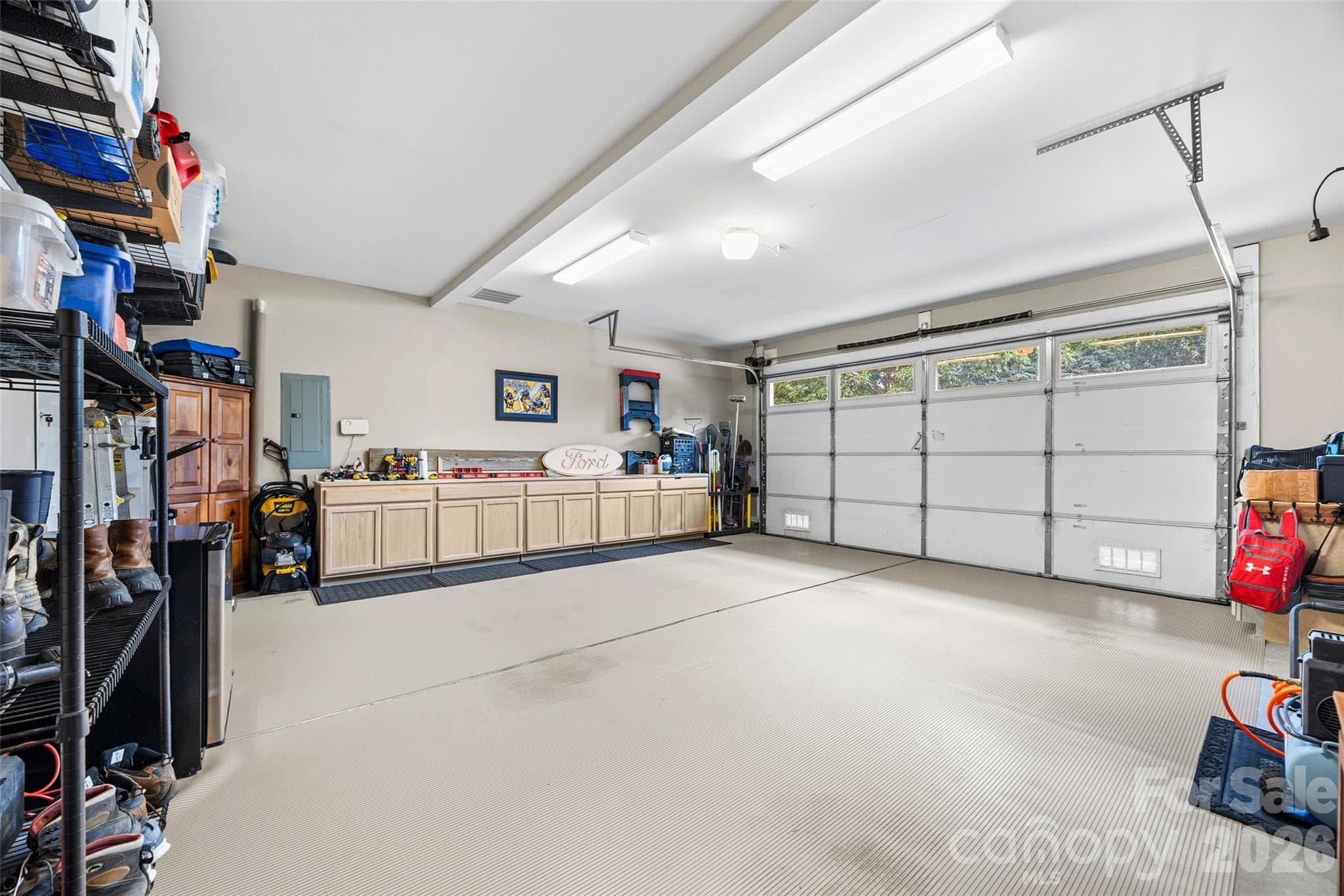 Newly installed built-in cabinets in the garage. There is also plenty of storage space. - 8621 Sequoia Grove Lane, Charlotte
