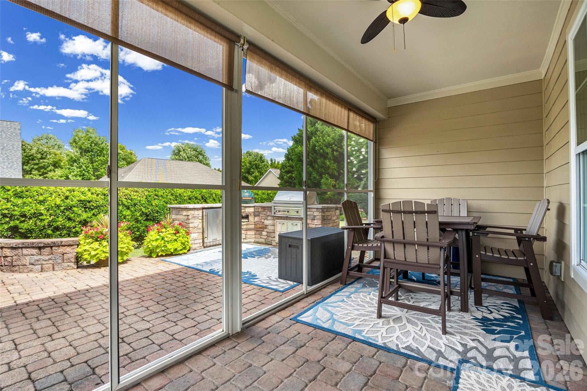 Screened-in porch off the great room with upgraded paver floor, which continues out onto the back patio area. - 8621 Sequoia Grove Lane, Charlotte