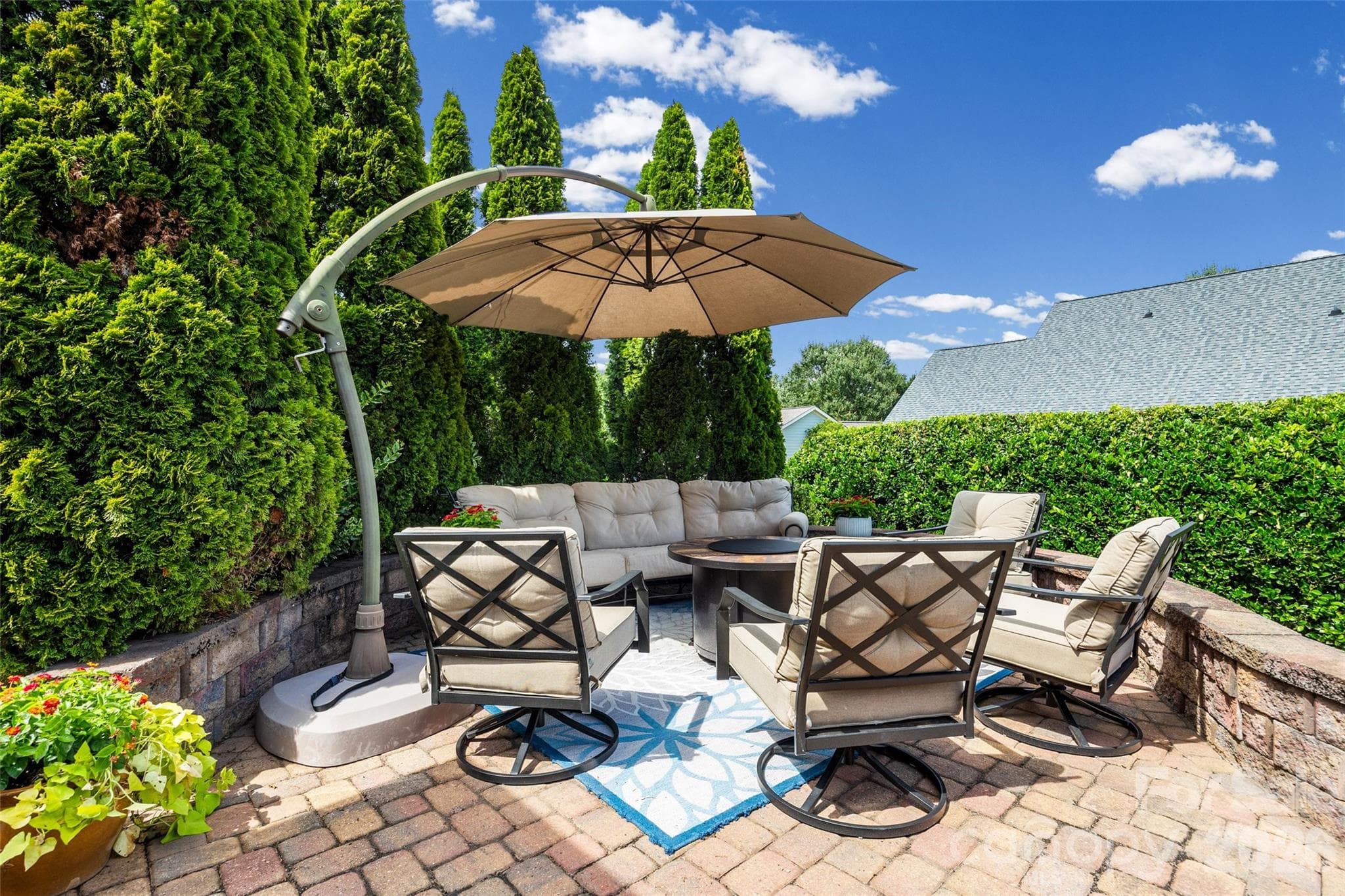 Great seating area with stone sitting wall. - 8621 Sequoia Grove Lane, Charlotte