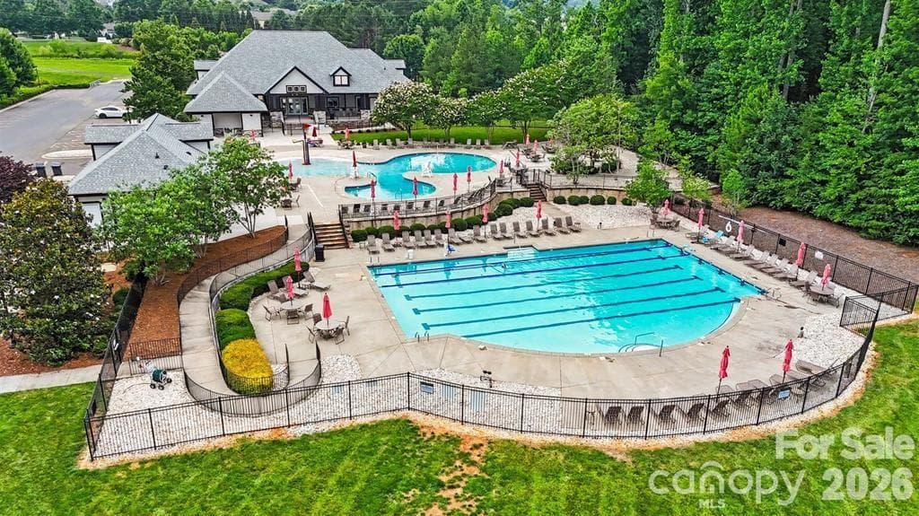 Clubhouse and pools. One pool has a kiddie play area. - 8621 Sequoia Grove Lane, Charlotte