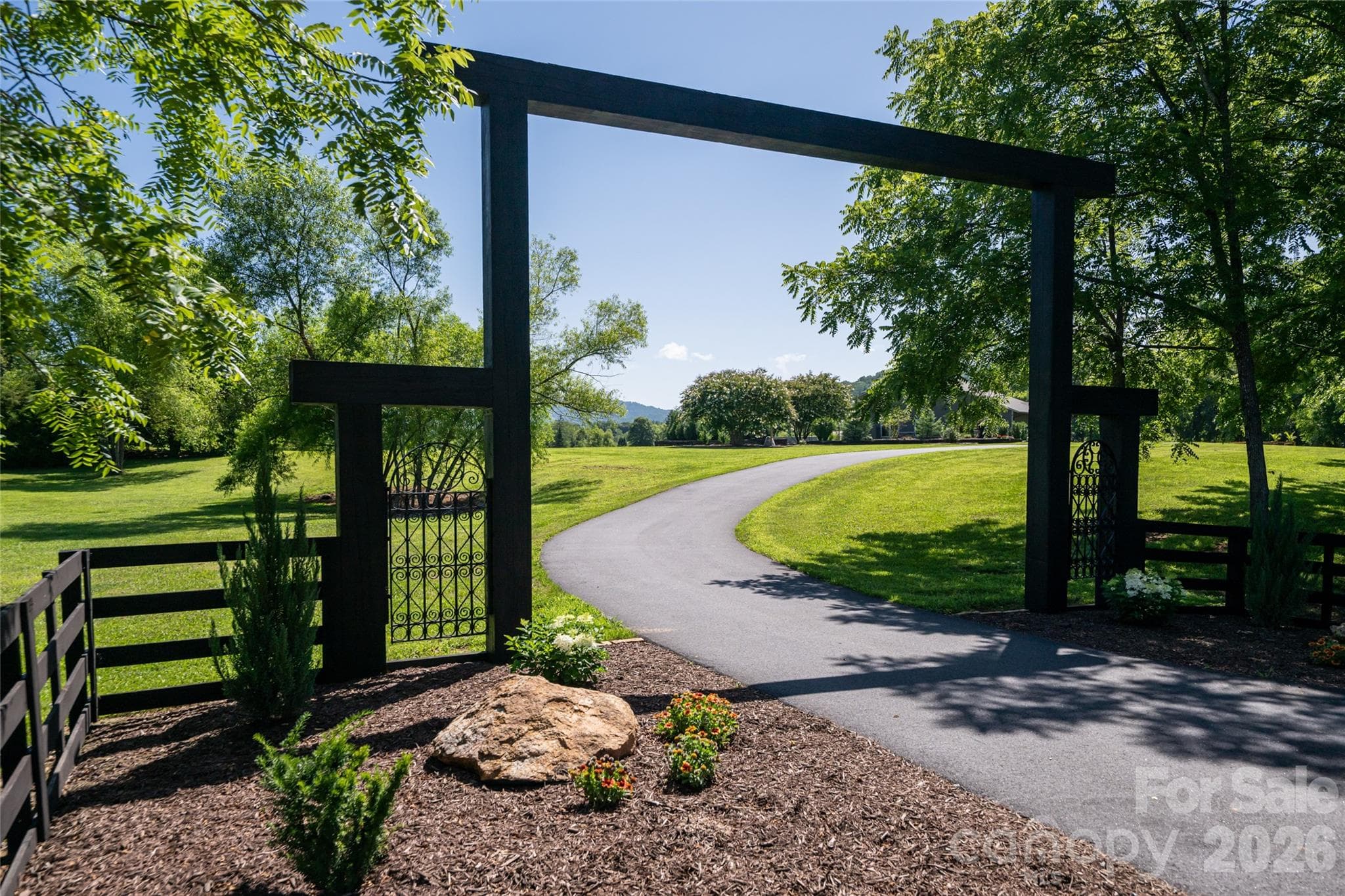 Drive through your entrance to almost 10 acres. - 660 Pleasant Grove Road, Hendersonville
