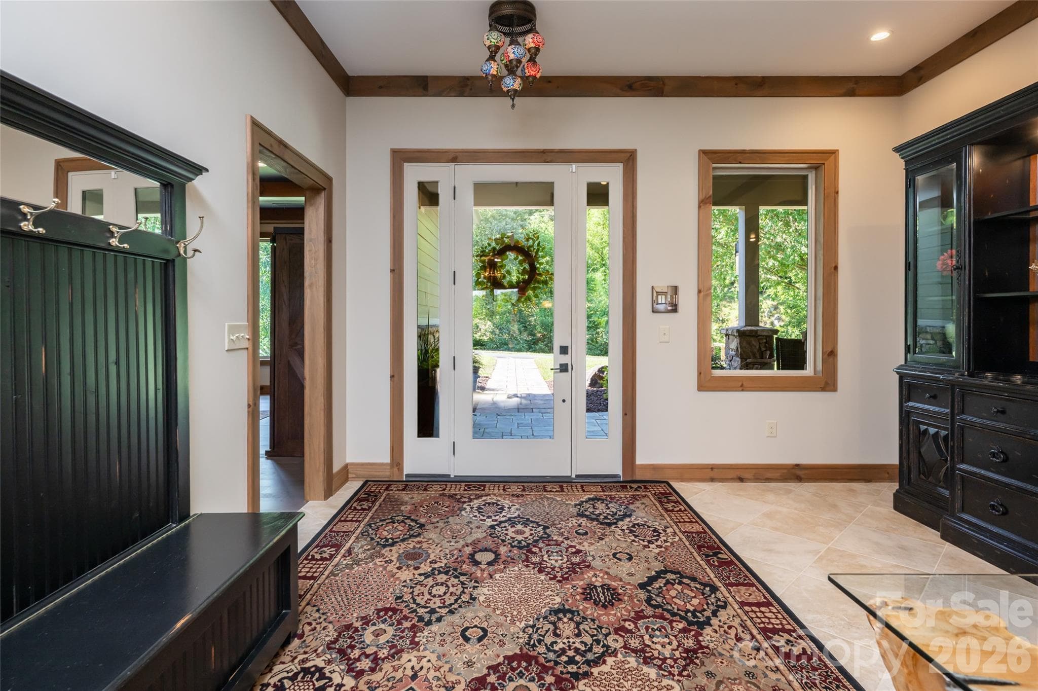 The entry foyer is spacious and bright. - 660 Pleasant Grove Road, Hendersonville