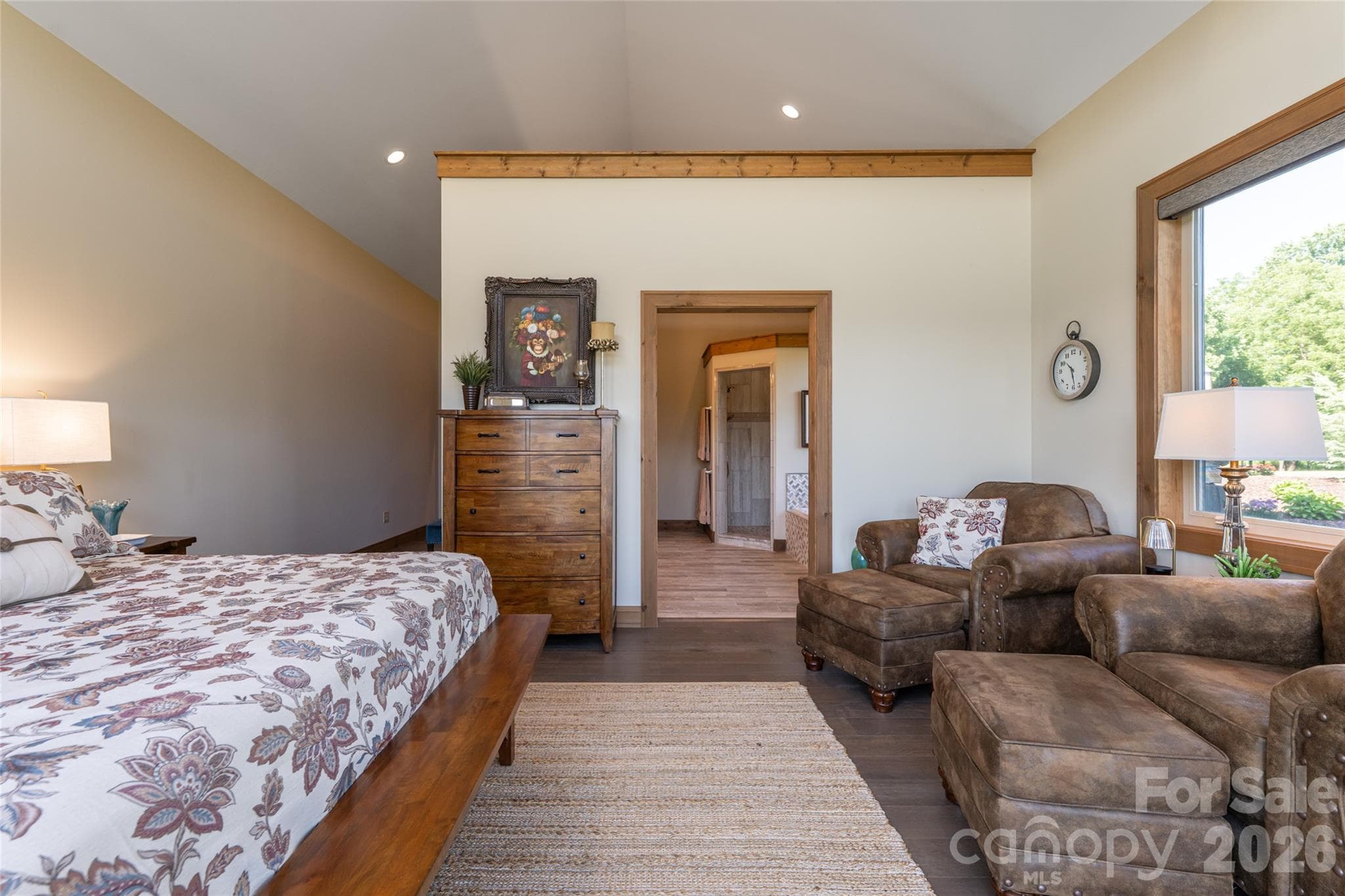 View from the primary bedroom into the spacious ensuite bathroom. - 660 Pleasant Grove Road, Hendersonville