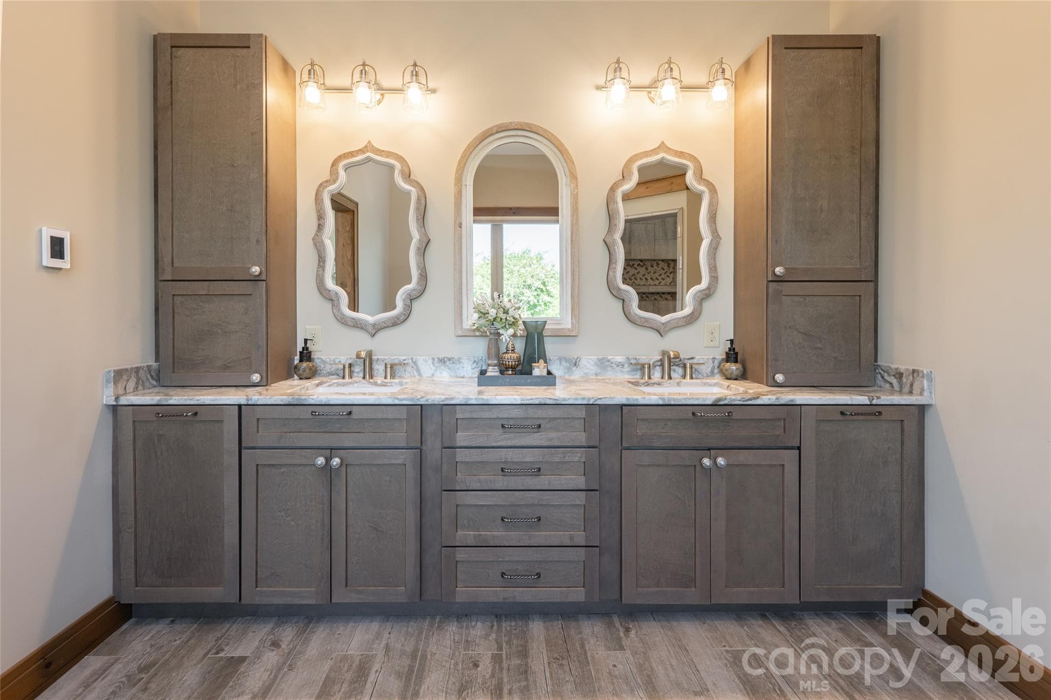 Dual sinks with granite countertop, abundant storage and soft-close drawers. - 660 Pleasant Grove Road, Hendersonville