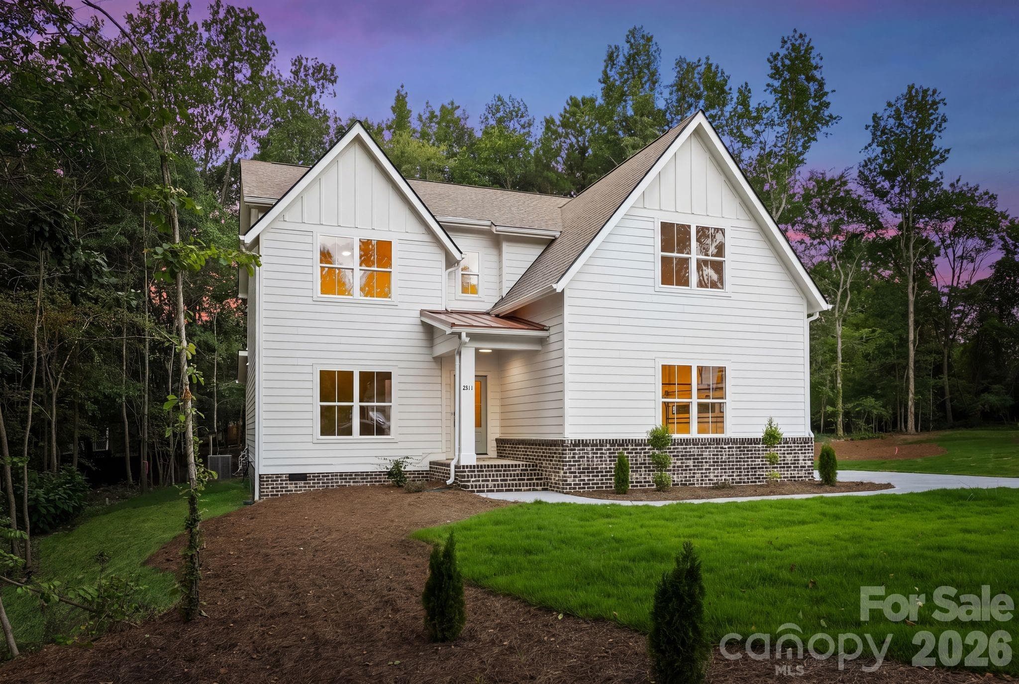 Side exterior view at twilight. - 2311 Chateau Court, Matthews