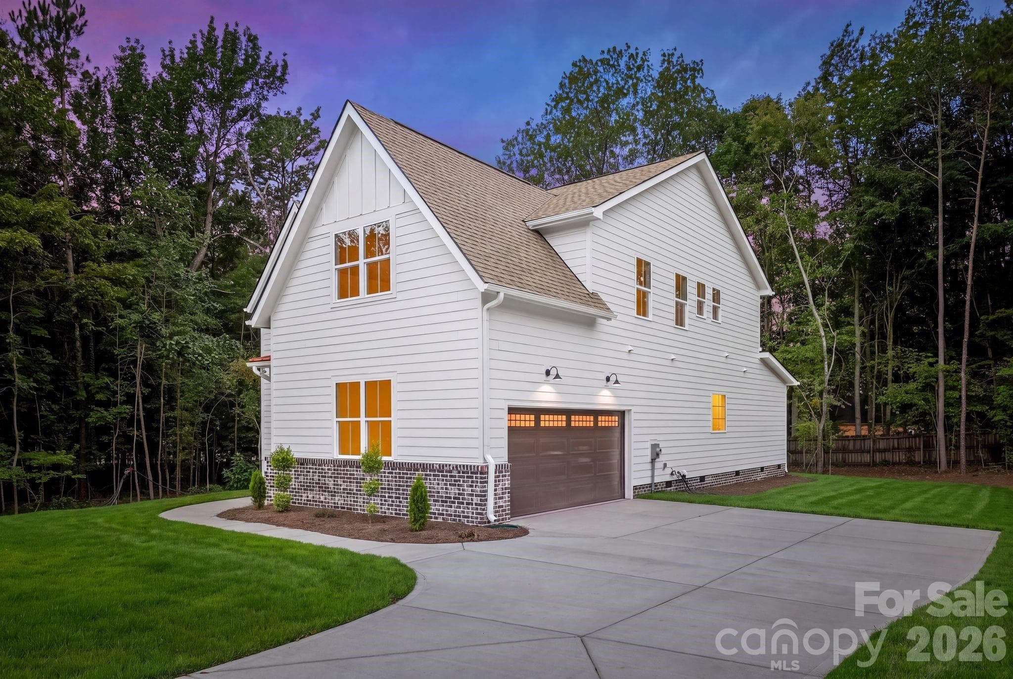 Side exterior view at twilight. - 2311 Chateau Court, Matthews