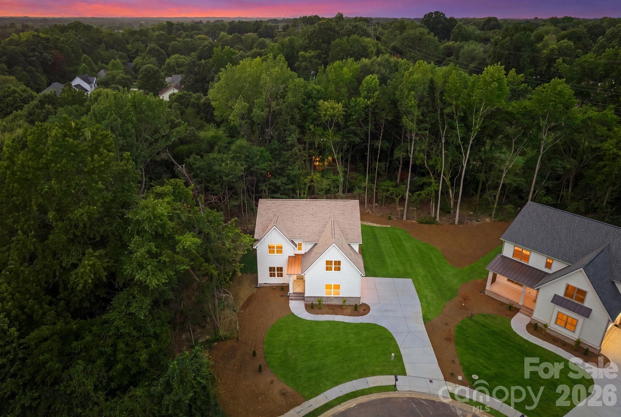 Aerial view at twilight. - 2311 Chateau Court, Matthews